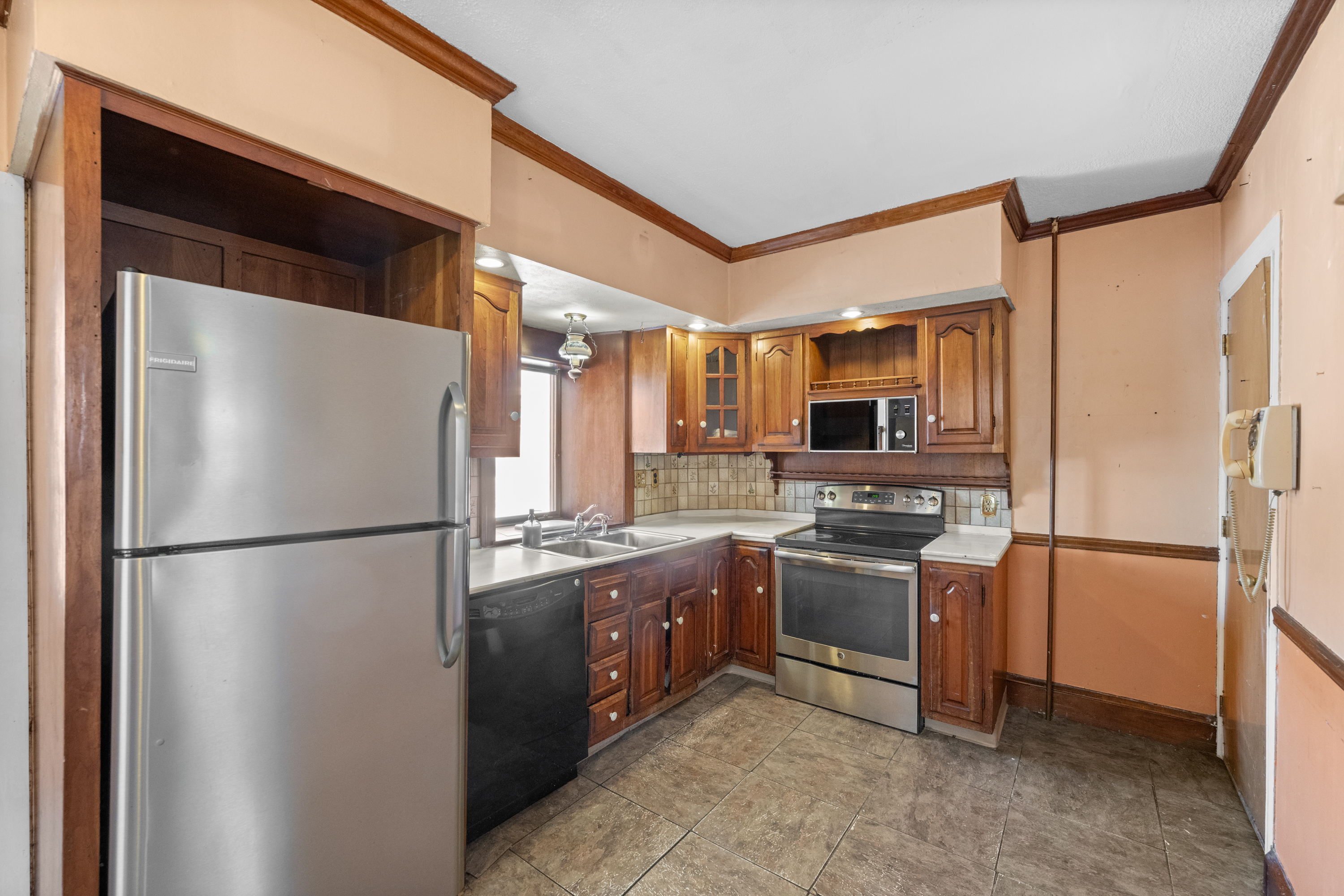 458 Renfrew Avenue Ambler, PA 19002 - Photo 9 of 32 a kitchen with stainless steel appliances granite countertop a refrigerator a stove and a sink