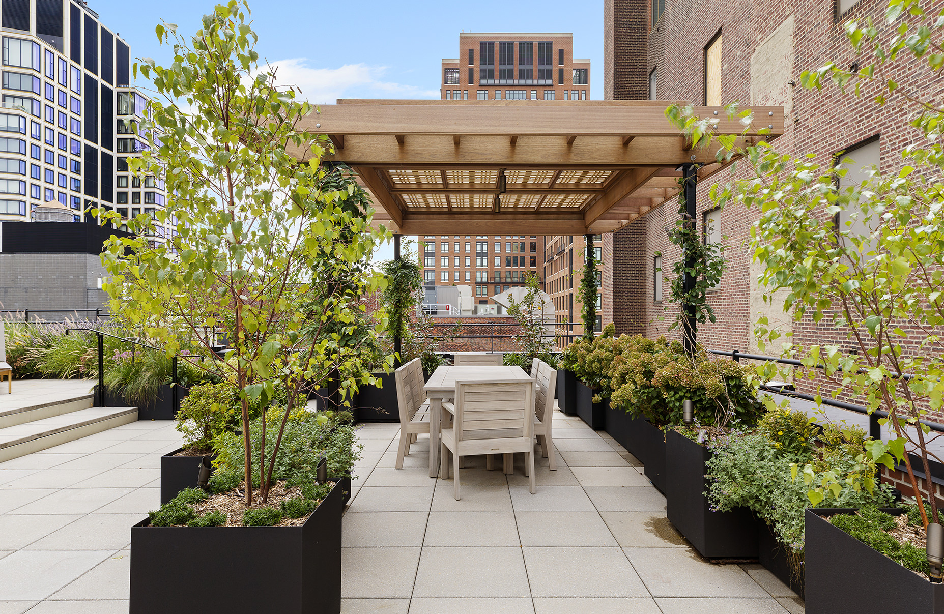525 West 22nd Street, Unit 3AF Manhattan, NY 10011 - Photo 23 of 25 a patio with table and chairs and potted plants