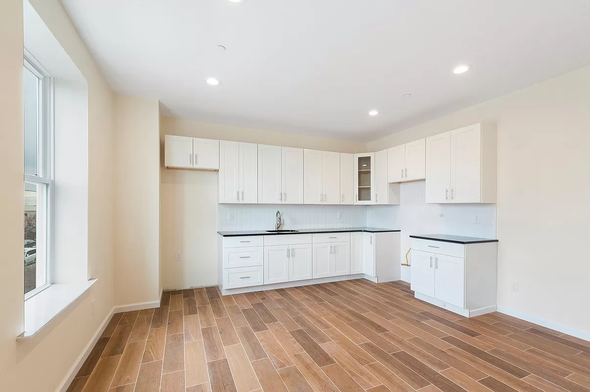 4015 Atlantic Avenue Brooklyn, NY 11224 - Photo 3 of 14 a view of kitchen with wooden floor and electronic appliances