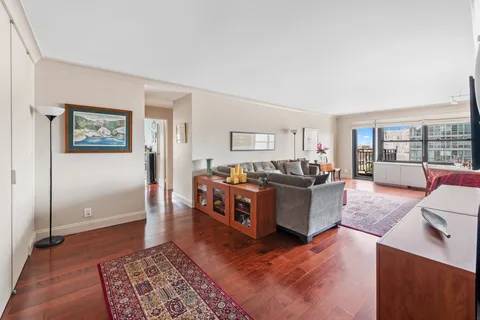 a living room with furniture and a rug