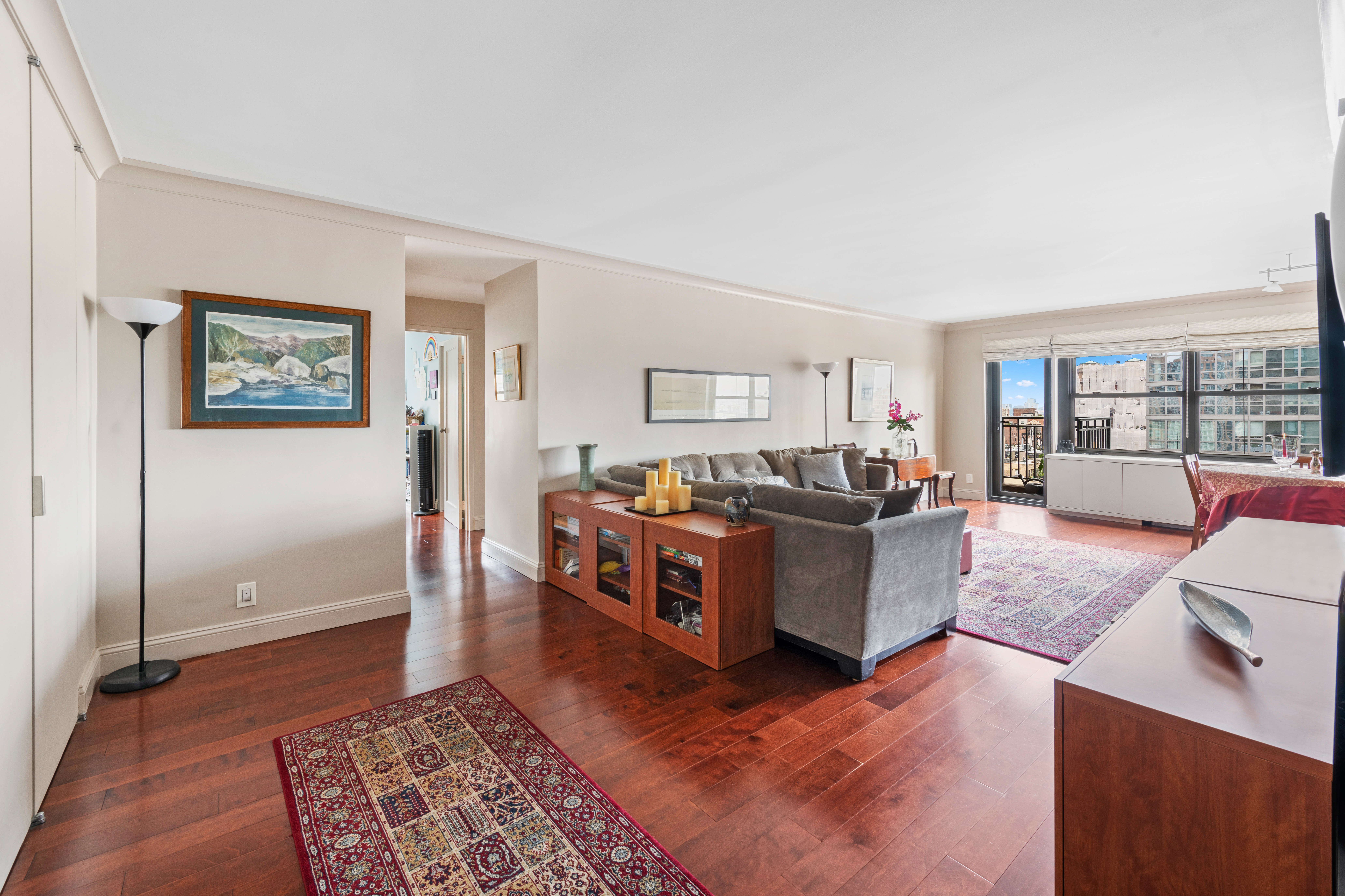 180 West End Avenue, Unit 25M Manhattan, NY 10023 - Photo 2 of 11 a living room with furniture and a rug