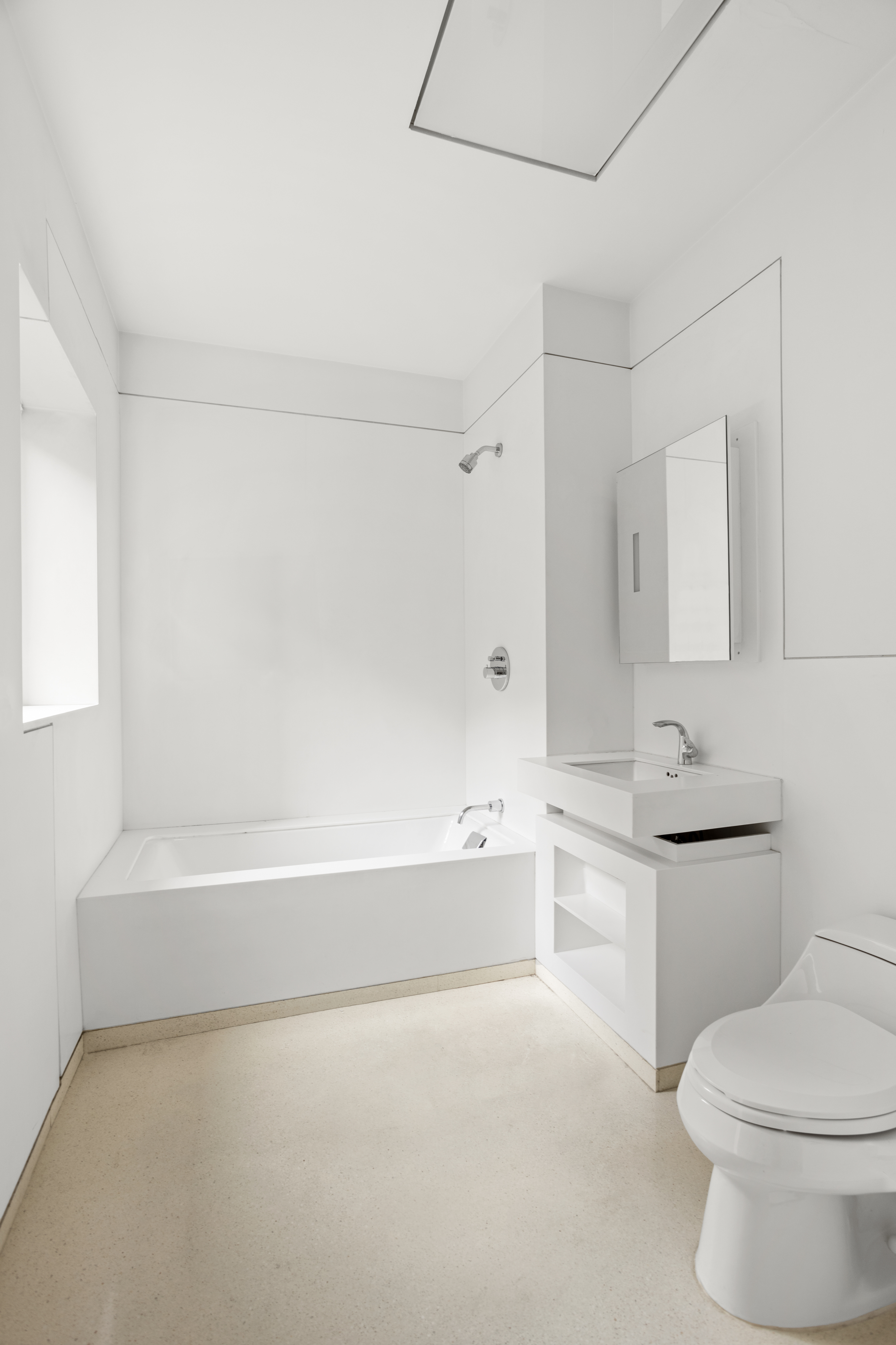 100 11th Avenue, Unit 5A Manhattan, NY 10011 - Photo 7 of 20 a bathroom with a toilet a sink and bathtub