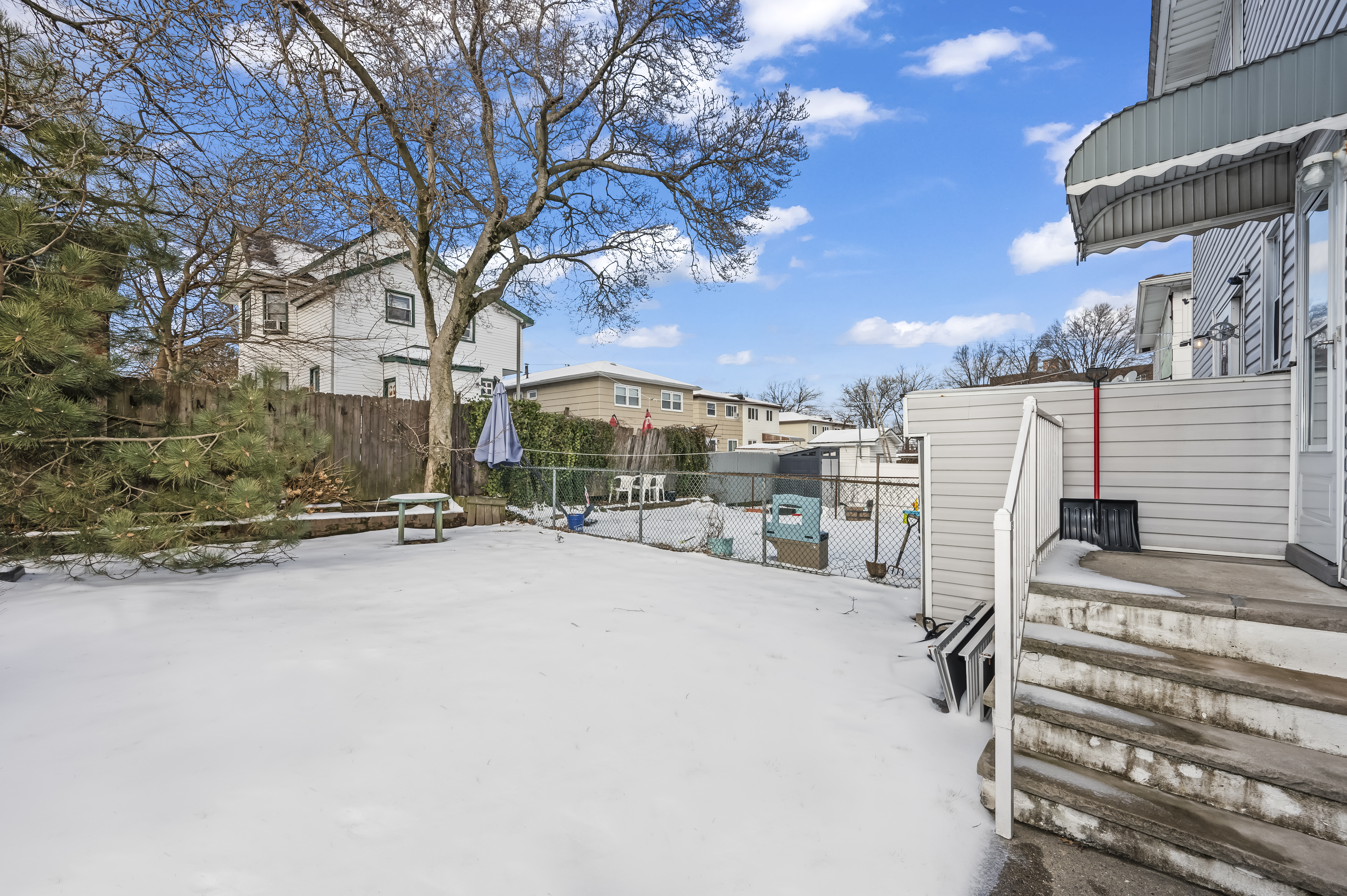 15 Area Place Staten Island, NY 10314 - Photo 24 of 27 a row of palm trees and a building in the background