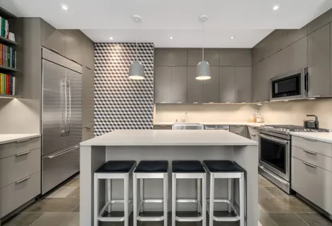 a kitchen with a sink cabinets and window