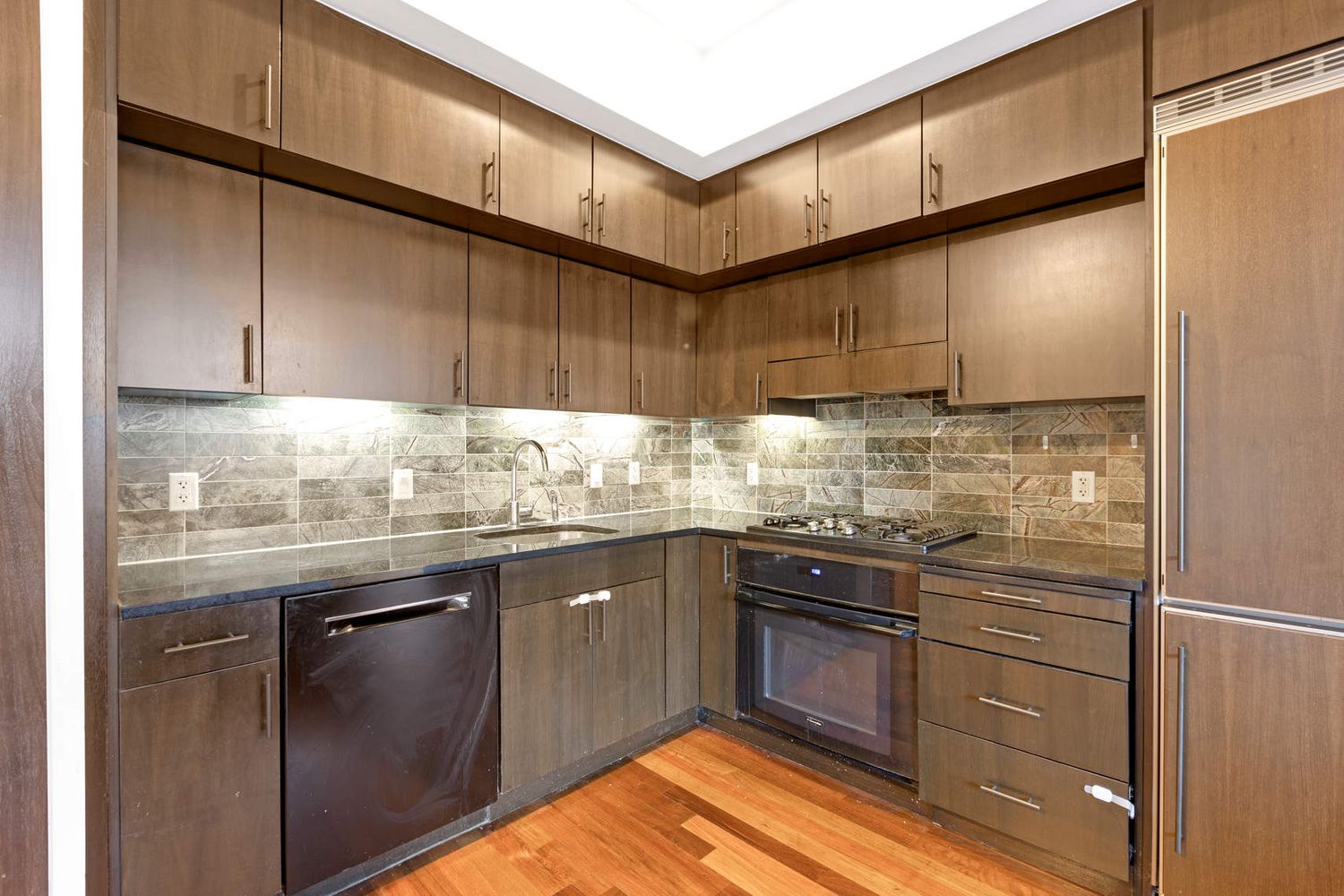 150 Myrtle Avenue, Unit 1005 Brooklyn, NY 11201 - Photo 2 of 21 a kitchen with granite countertop stainless steel appliances and cabinets