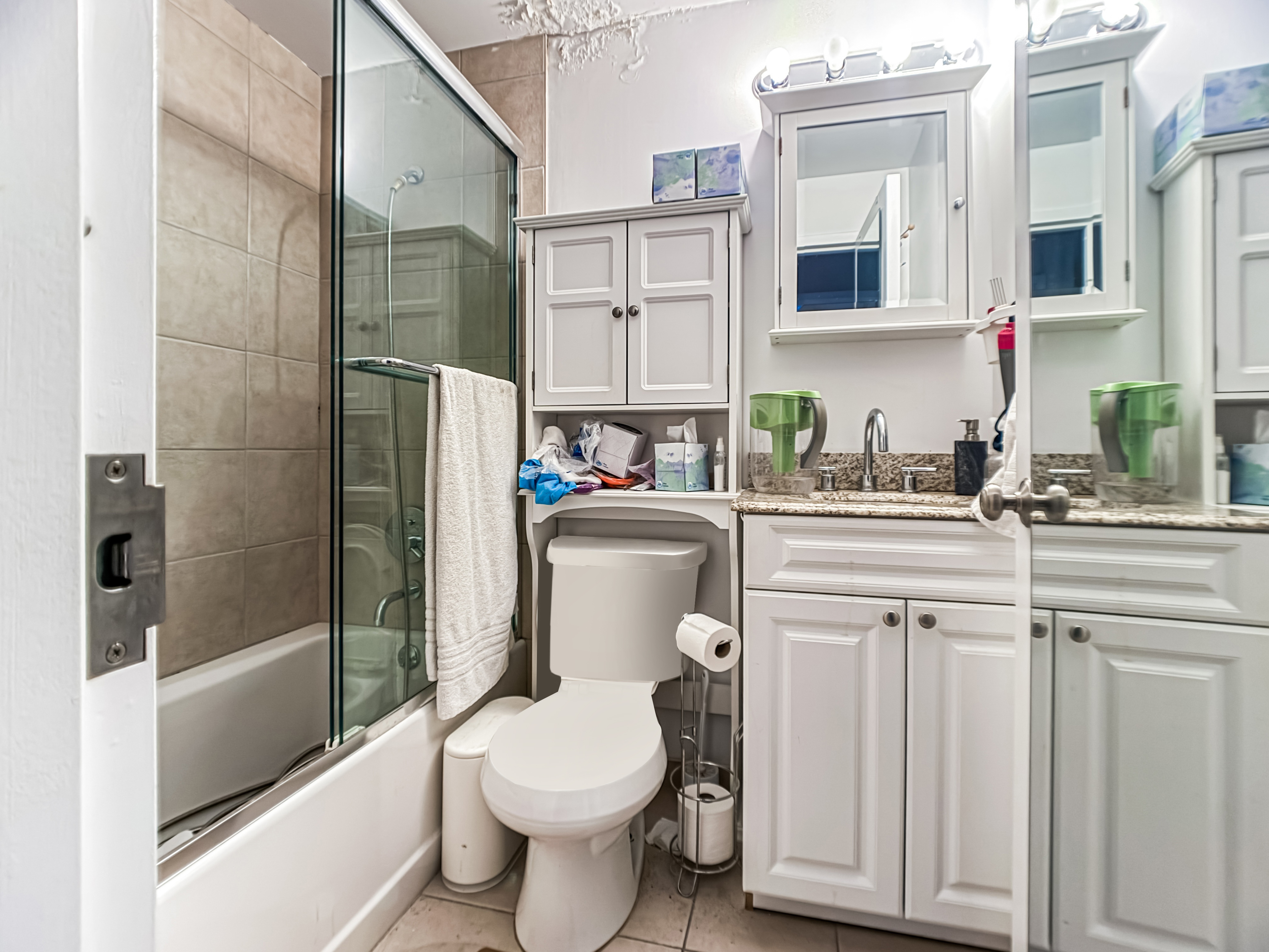 3827 28th Street Queens, NY 11101 - Photo 11 of 13 a bathroom with a sink toilet and shower