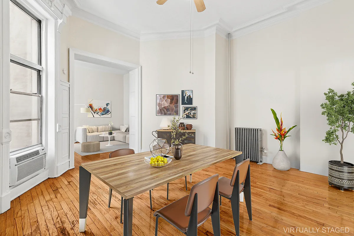 1102 Dean Street, Unit 4 Brooklyn, NY 11216 - Photo 3 of 12 a dining room with furniture and wooden floor