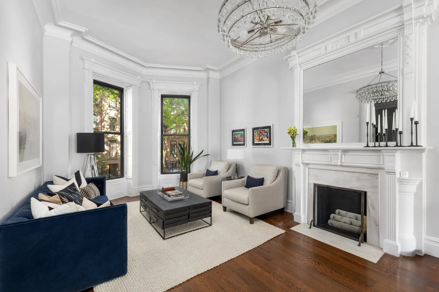 a living room with furniture a fireplace and a table