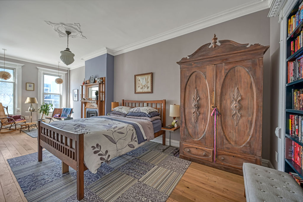 315 15th Street Brooklyn, NY 11215 - Photo 12 of 25 a bedroom with a bed a dresser and book shelf