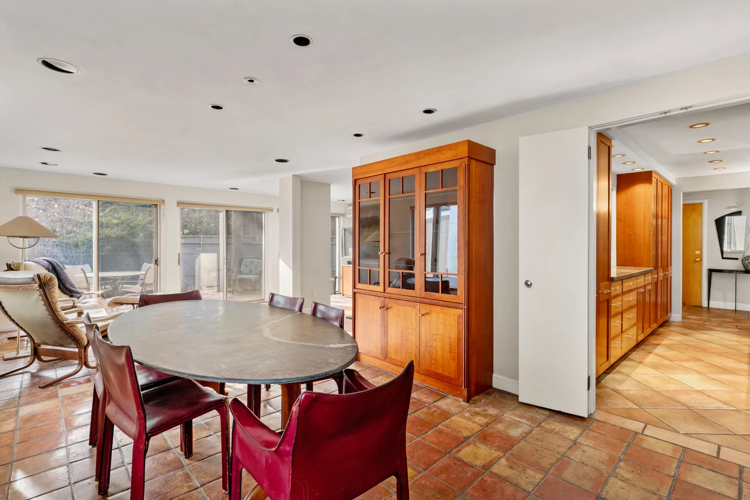 a kitchen with a table and chairs