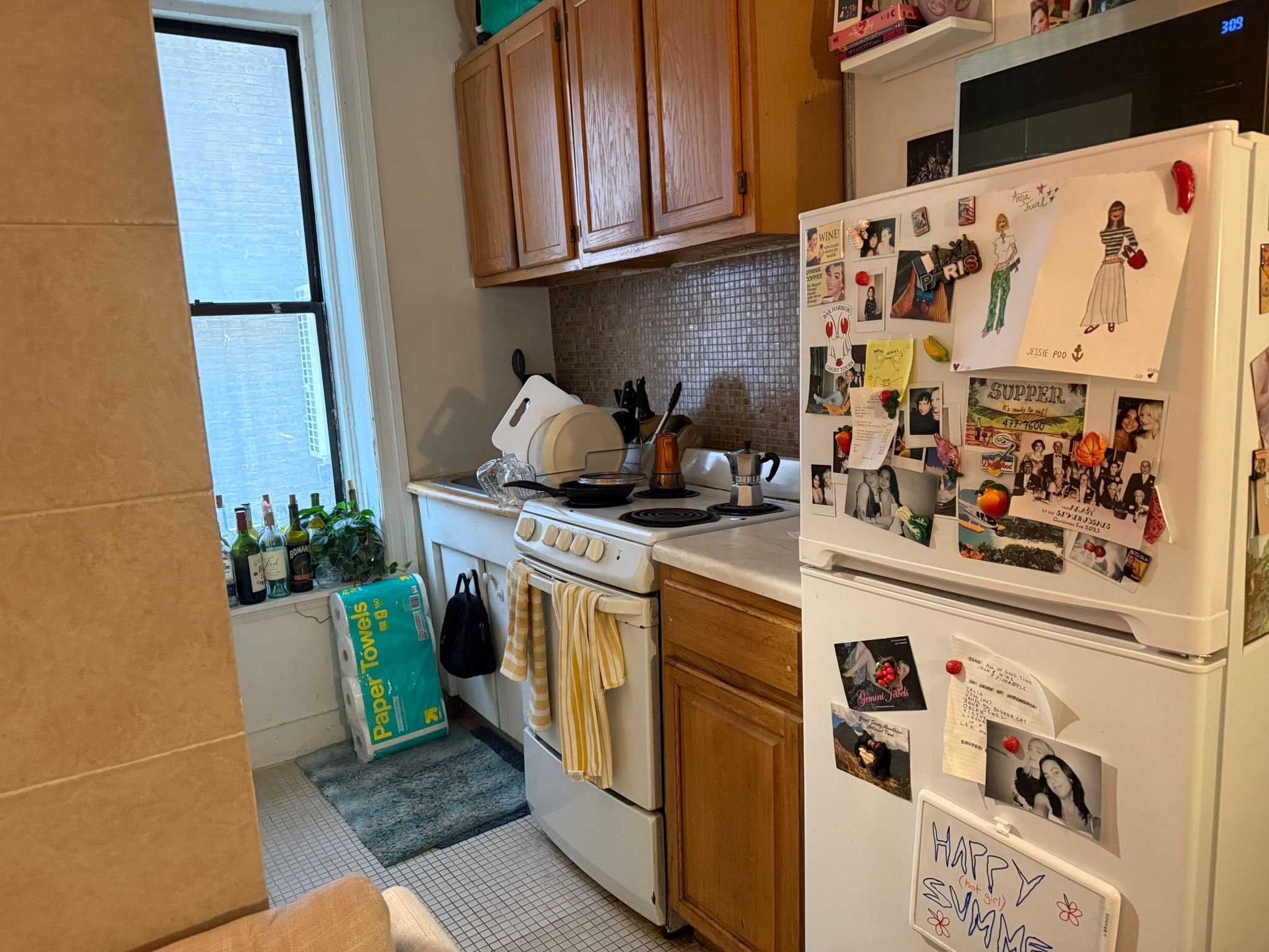 1278 1st Avenue, Unit 2 Manhattan, NY 10065 - Photo 8 of 19 a kitchen with stainless steel appliances granite countertop a refrigerator and a stove