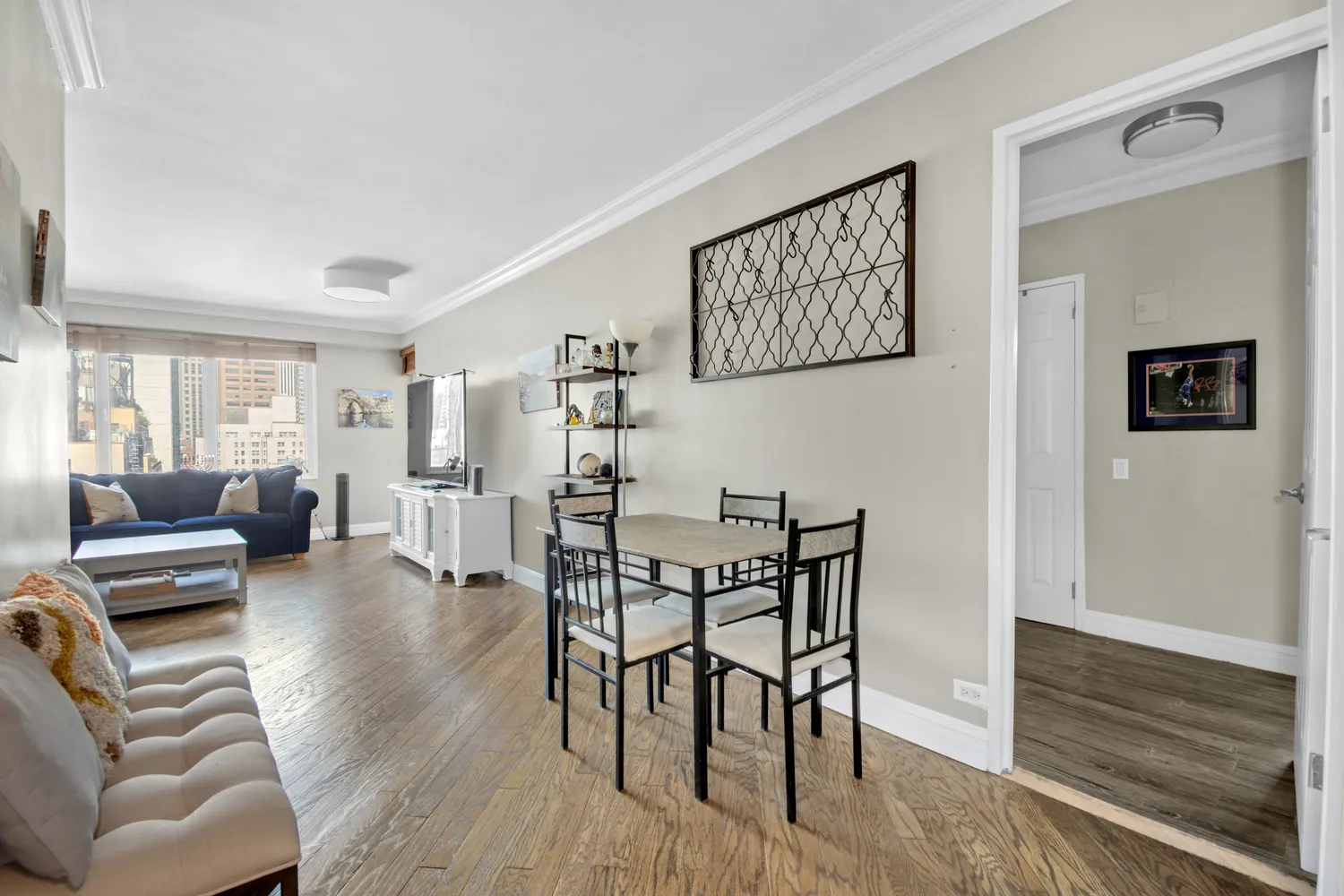a view of a livingroom with furniture and wooden floor