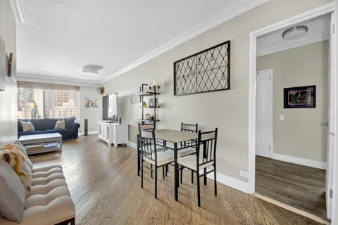 a view of a livingroom with furniture and wooden floor