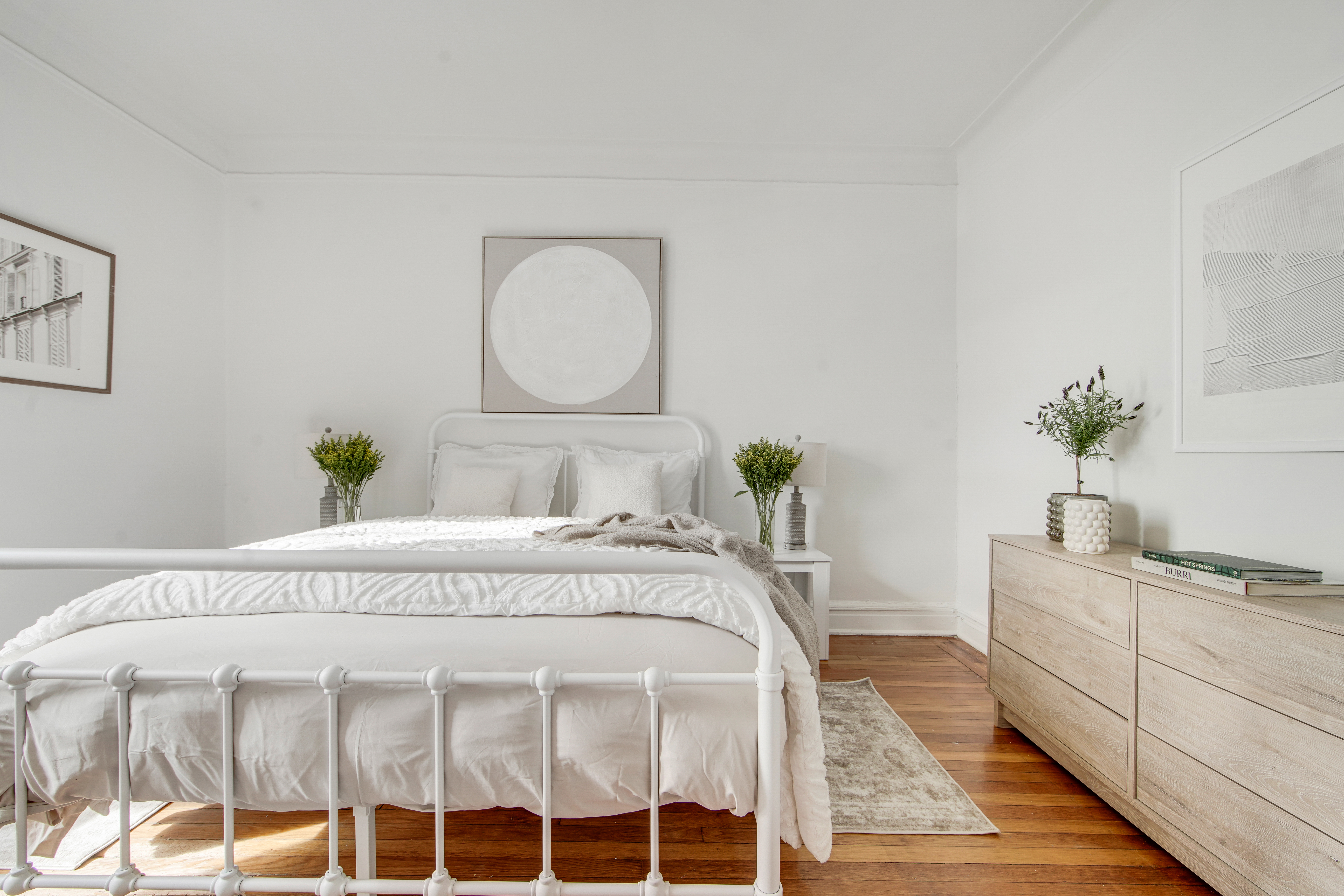 2 Grace Court, Unit 1X Brooklyn, NY 11201 - Photo 7 of 12 a spacious bedroom with a bed table and a mirror