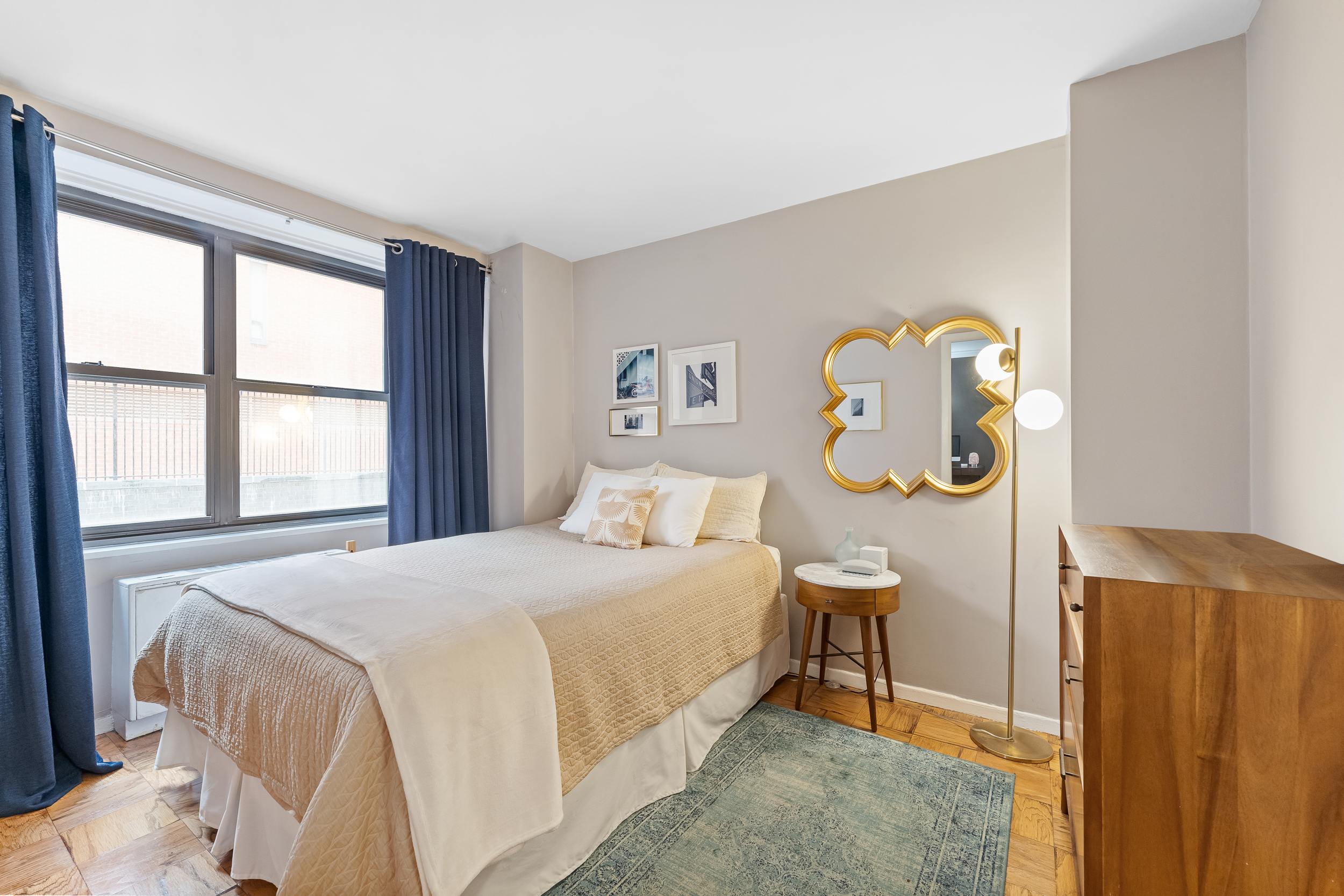 7 East 14th Street, Unit 302 Manhattan, NY 10003 - Photo 3 of 6 a bedroom with a bed and a window