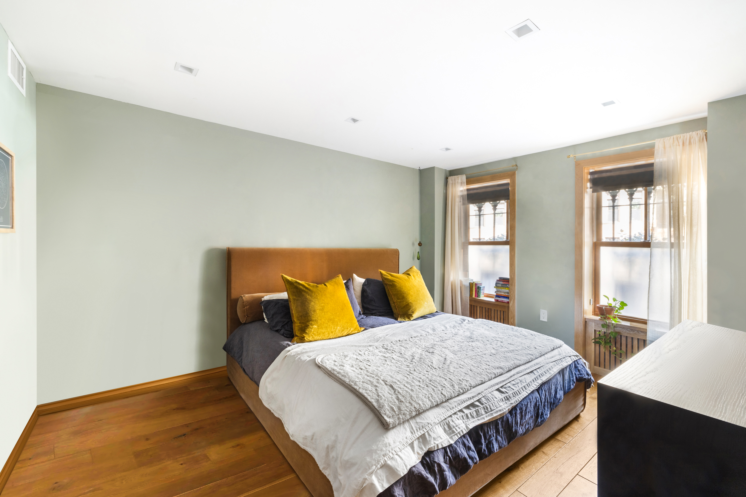 252 Stuyvesant Brooklyn, NY 11221 - Photo 11 of 18 a bedroom with a bed and window