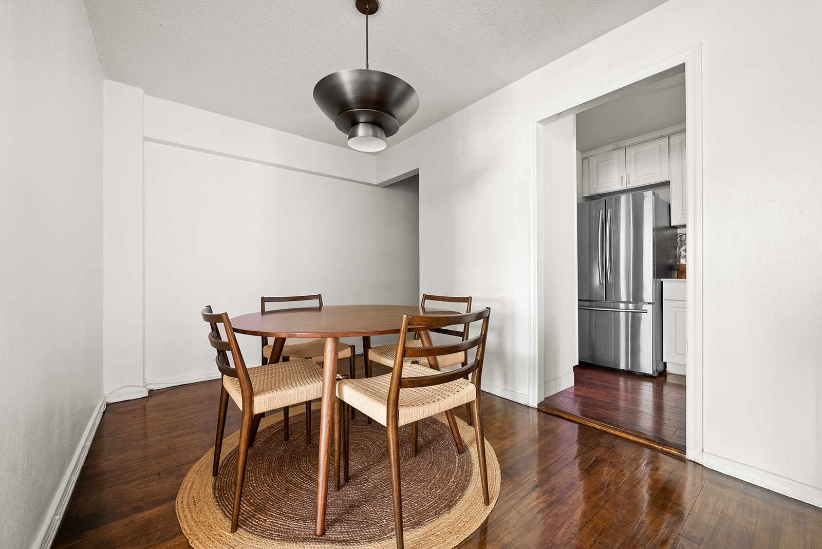 33-26 82nd Street, Unit 1H Queens, NY 11372 - Photo 2 of 11 a view of a dining room with furniture