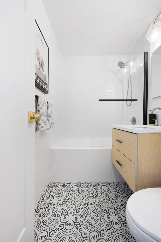 a bathroom with a bathtub sink and toilet