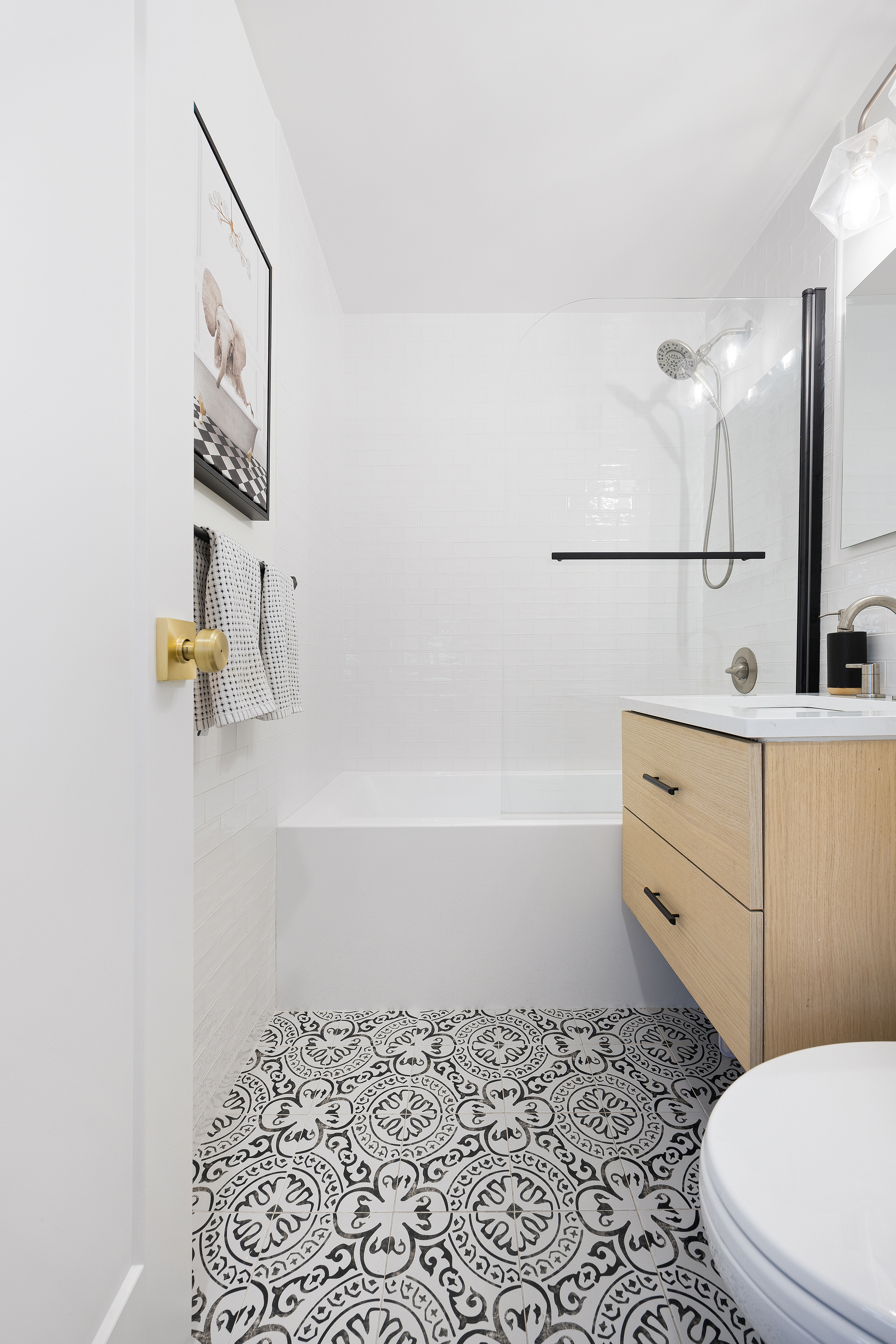 333 East 79th Street, Unit 18N Manhattan, NY 10075 - Photo 10 of 11 a bathroom with a bathtub sink and toilet