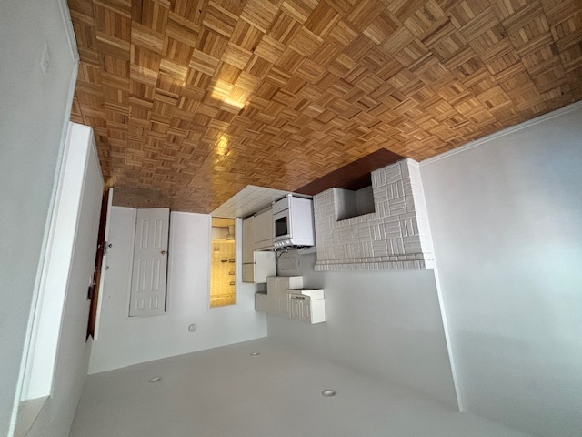 138 East 34th Street, Unit 3F Manhattan, NY 10016 - Photo 2 of 6 a bedroom with a bed and a fireplace