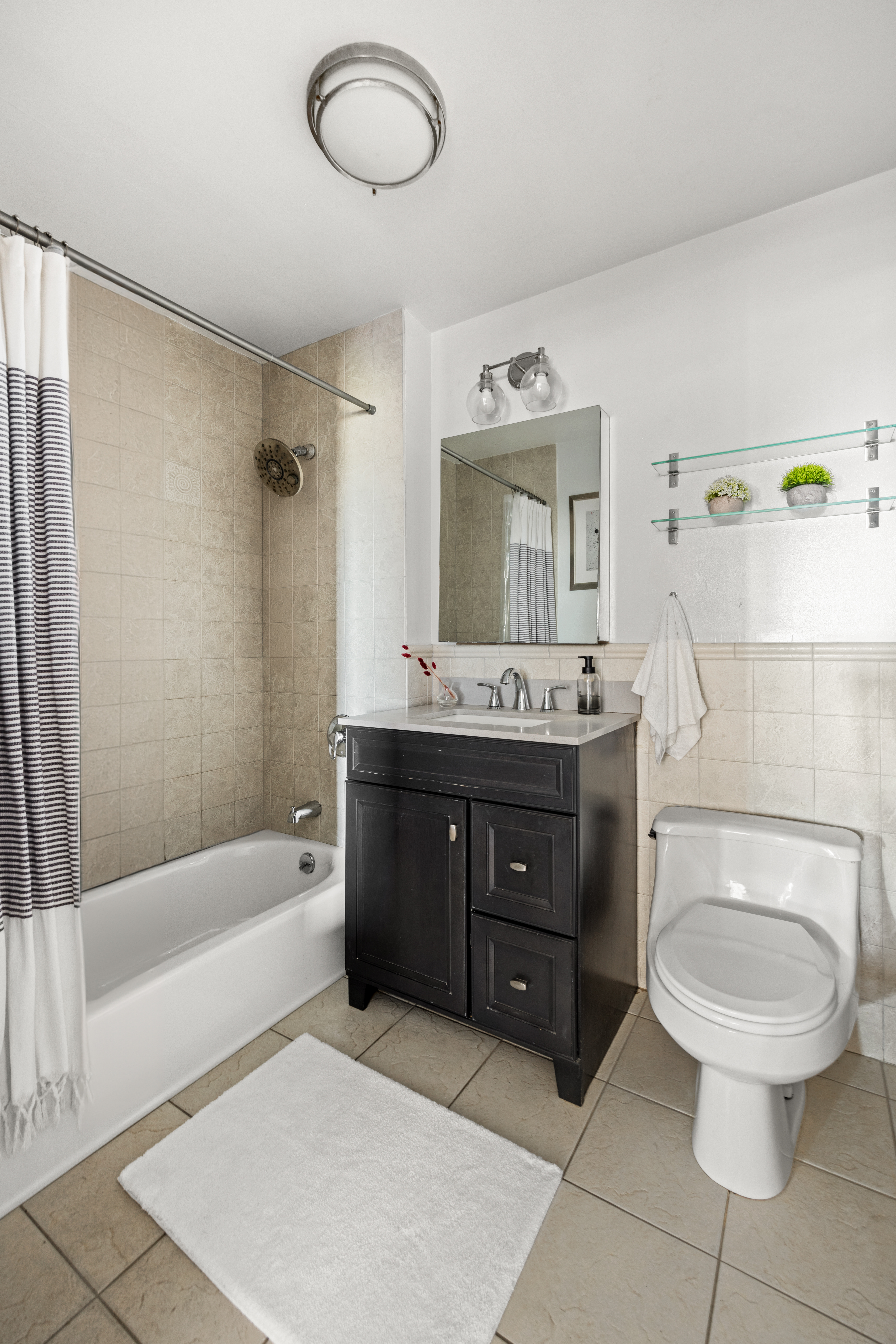 93 Rapelye Street, Unit 6C Brooklyn, NY 11231 - Photo 11 of 14 a bathroom with a sink a toilet and bathtub