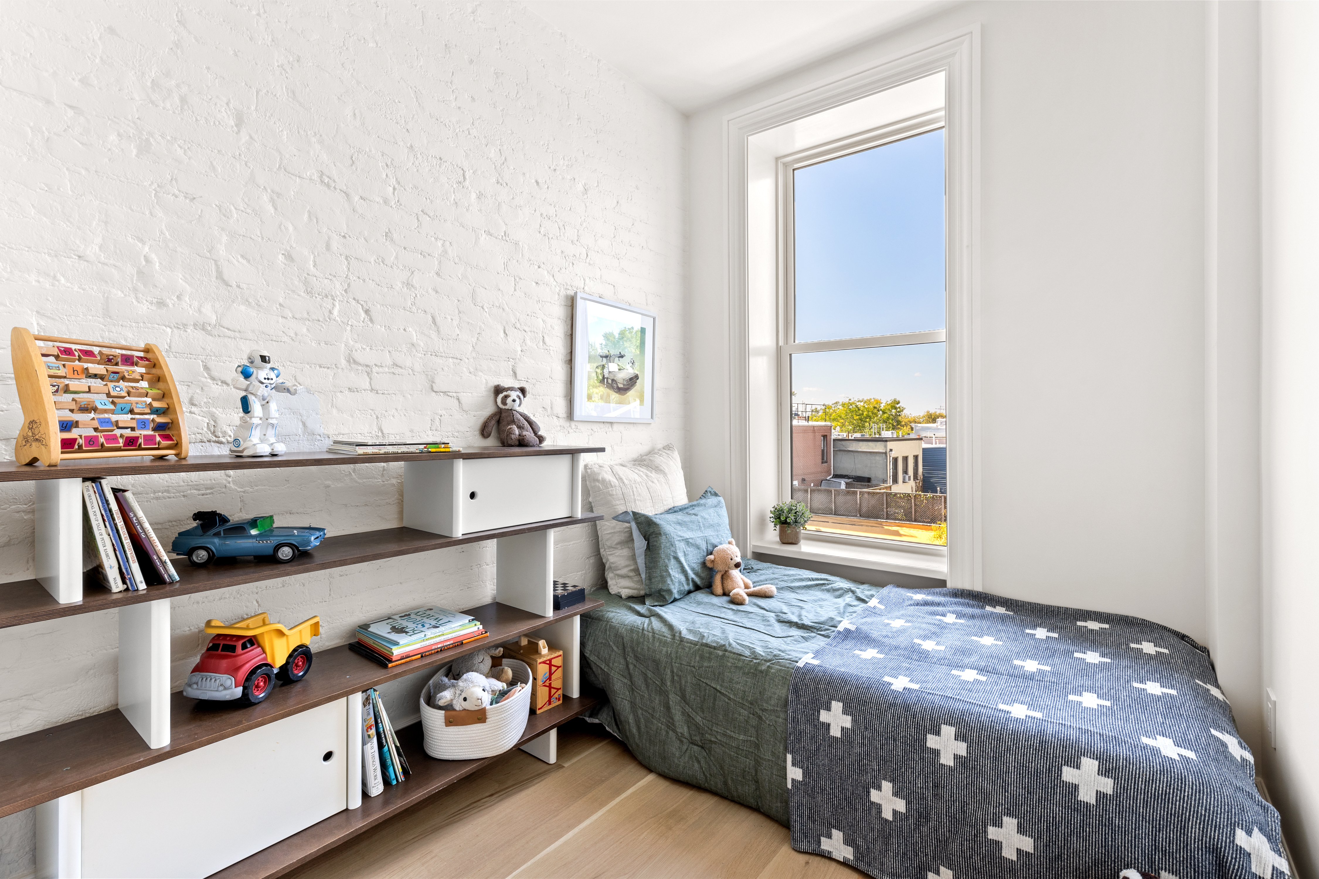 489 7th Avenue, Unit 3 Brooklyn, NY 11215 - Photo 7 of 11 a bedroom with a bed and a window