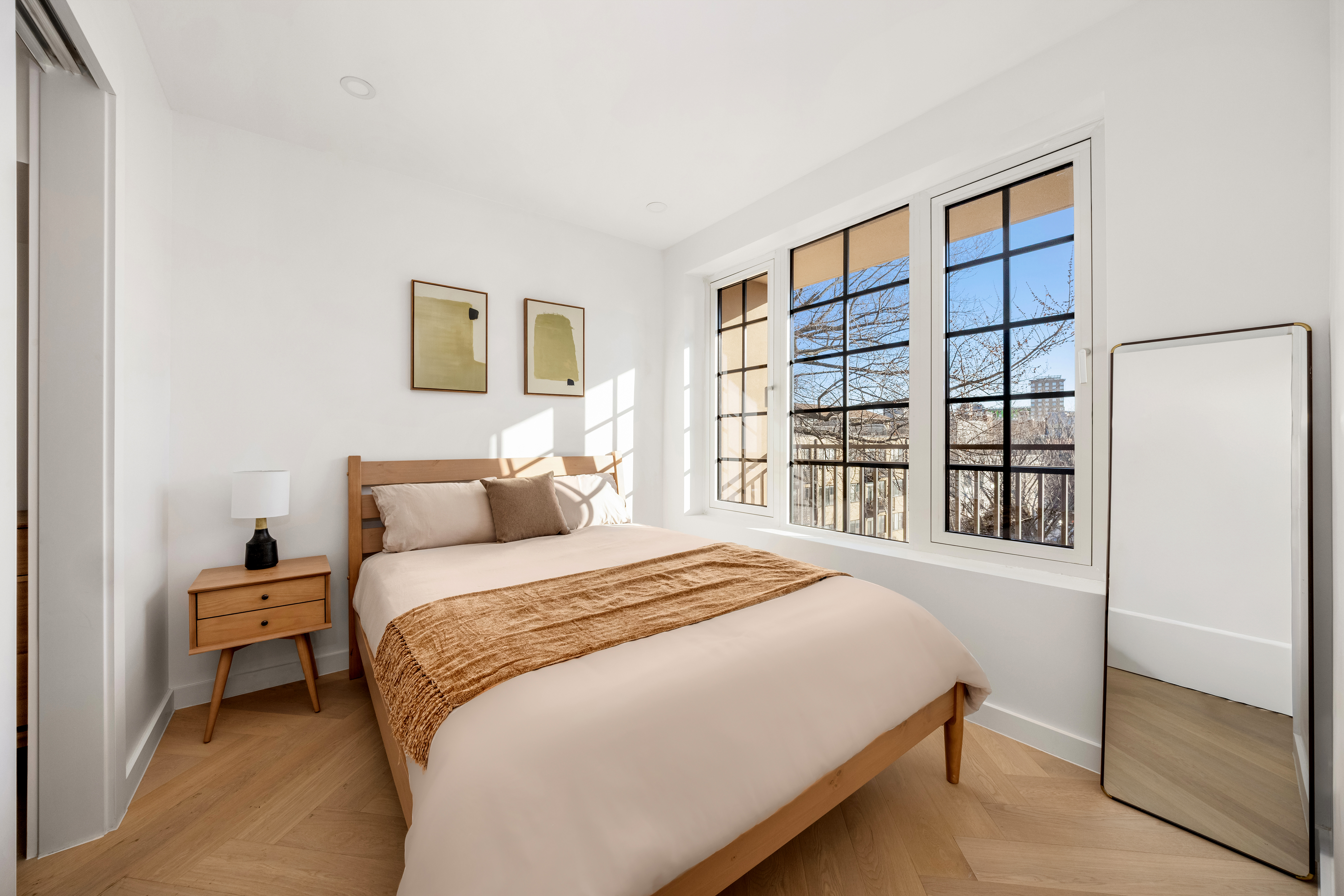 90 Herbert Street, Unit PHB Brooklyn, NY 11222 - Photo 4 of 15 a bedroom with a large bed and a window