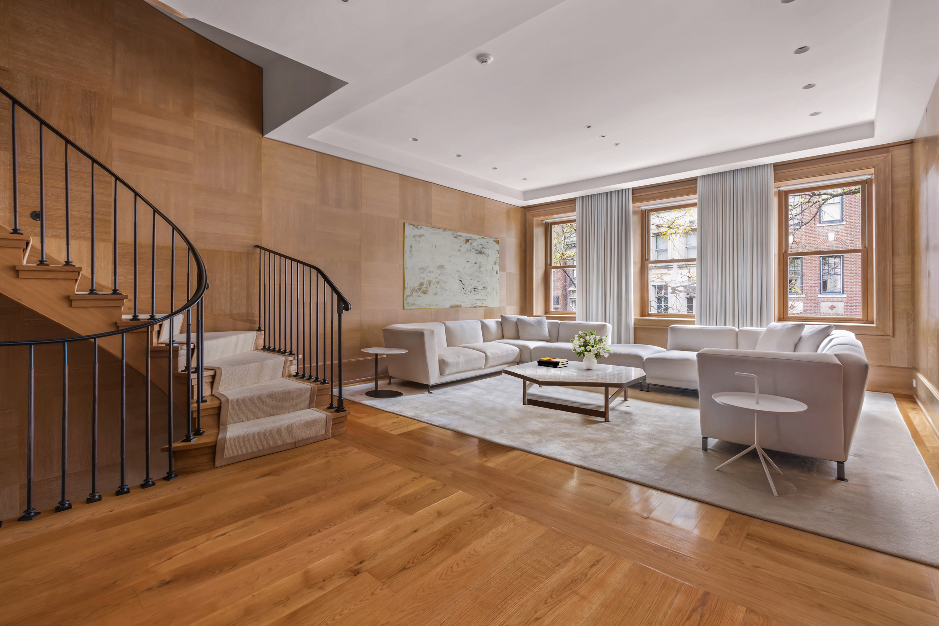45 East 74th Street Manhattan, NY 10021 - Photo 9 of 33 a living room with furniture and a table with wooden floor
