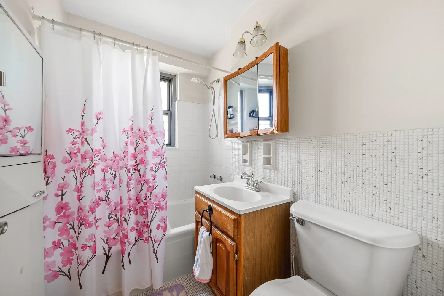 a bedroom with two beds and a window