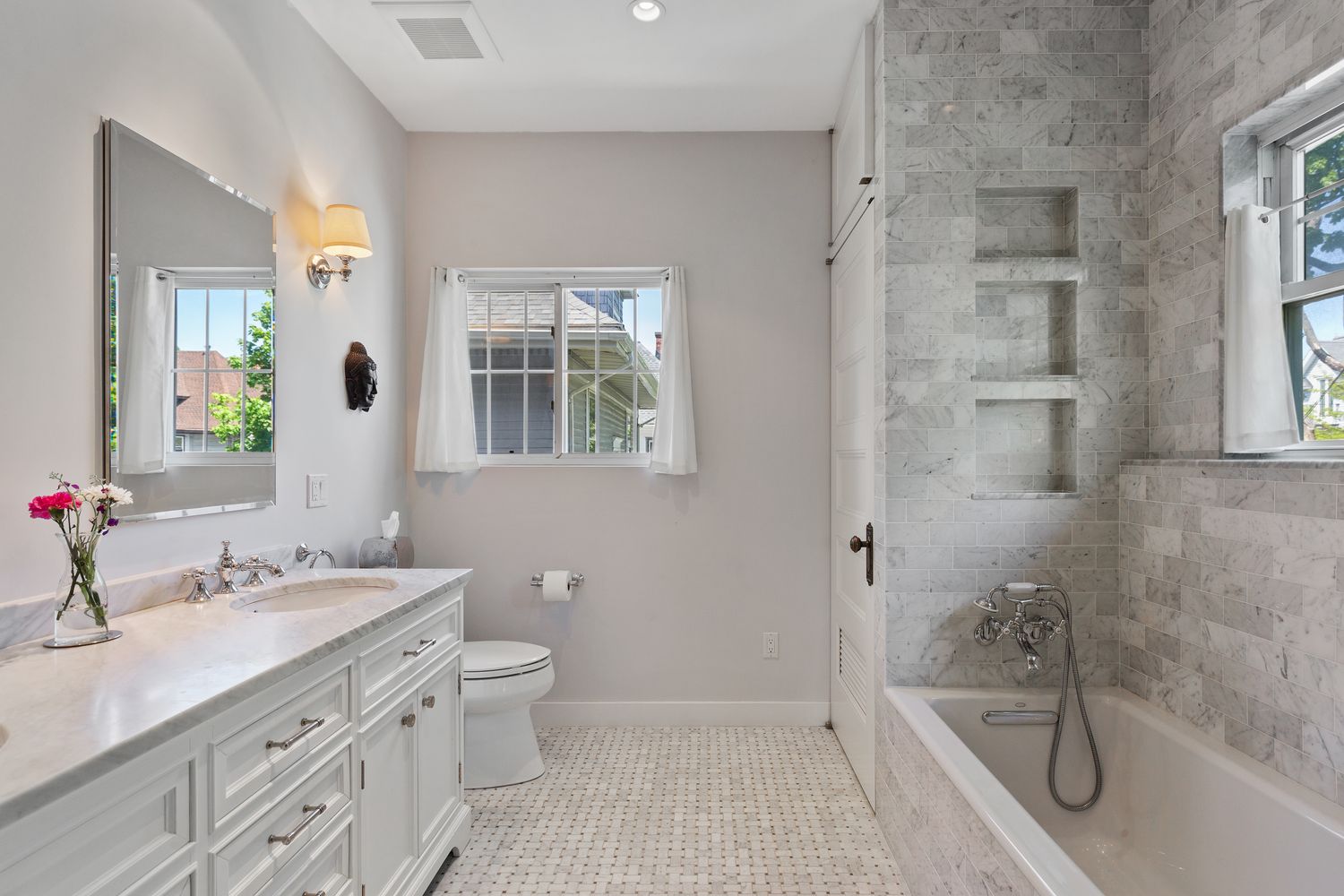 685 East 22nd Street Brooklyn, NY 11210 - Photo 17 of 43 a bathroom with a granite countertop sink a toilet a mirror and shower