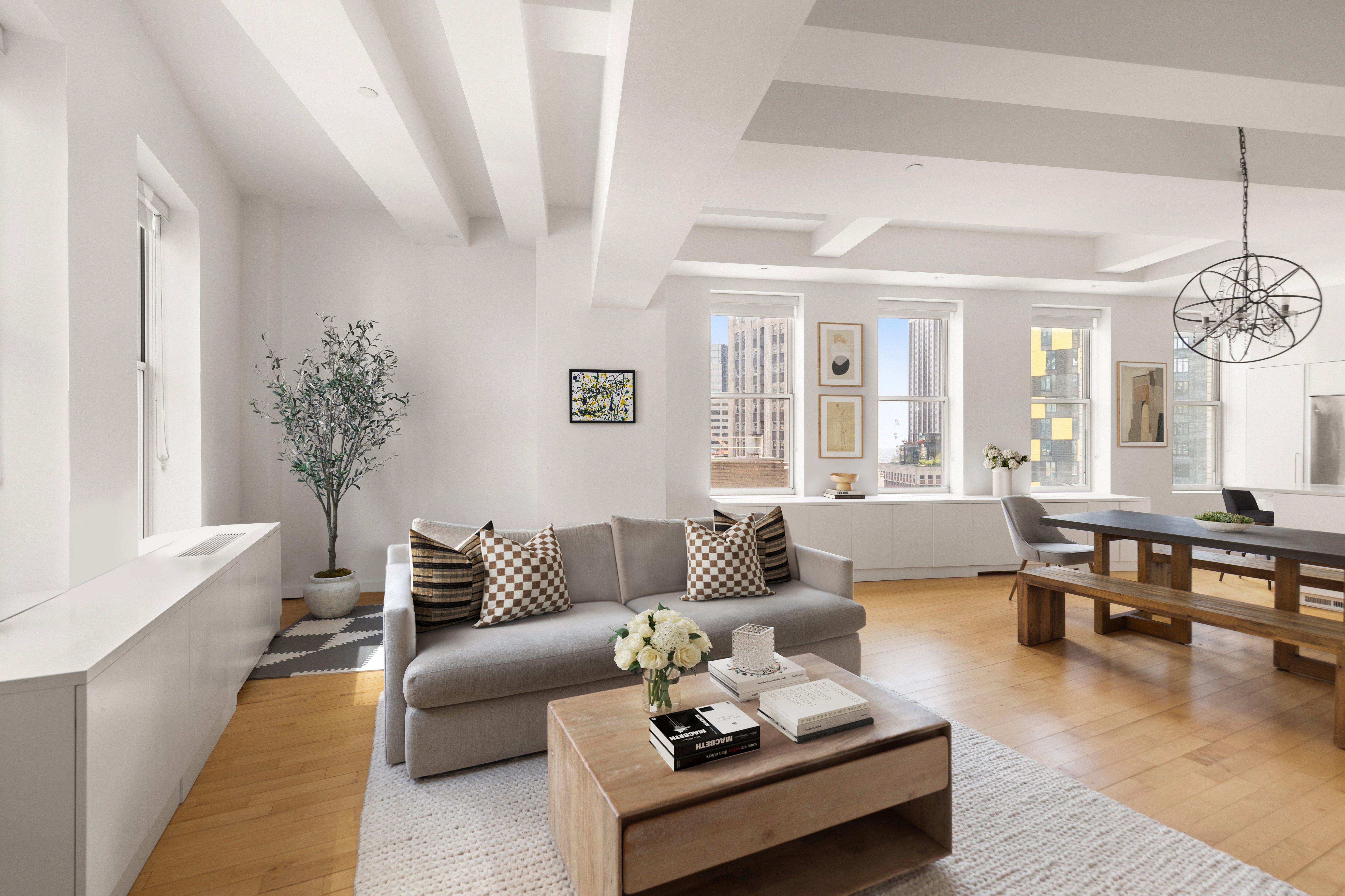 15 Broad Street, Unit 3100 Manhattan, NY 10005 - Photo 2 of 27 a living room with furniture and wooden floor