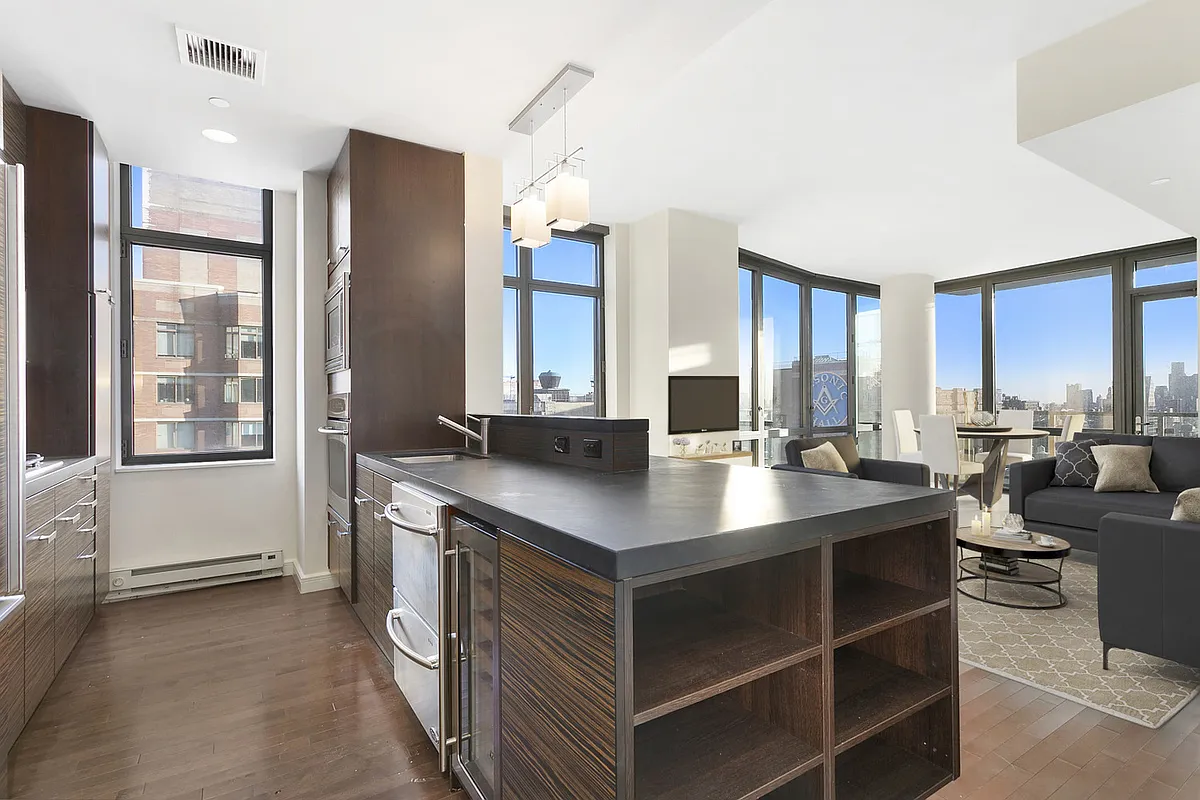 101 West 24th Street, Unit 26D Manhattan, NY 10011 - Photo 2 of 18 a kitchen with a sink stove and refrigerator