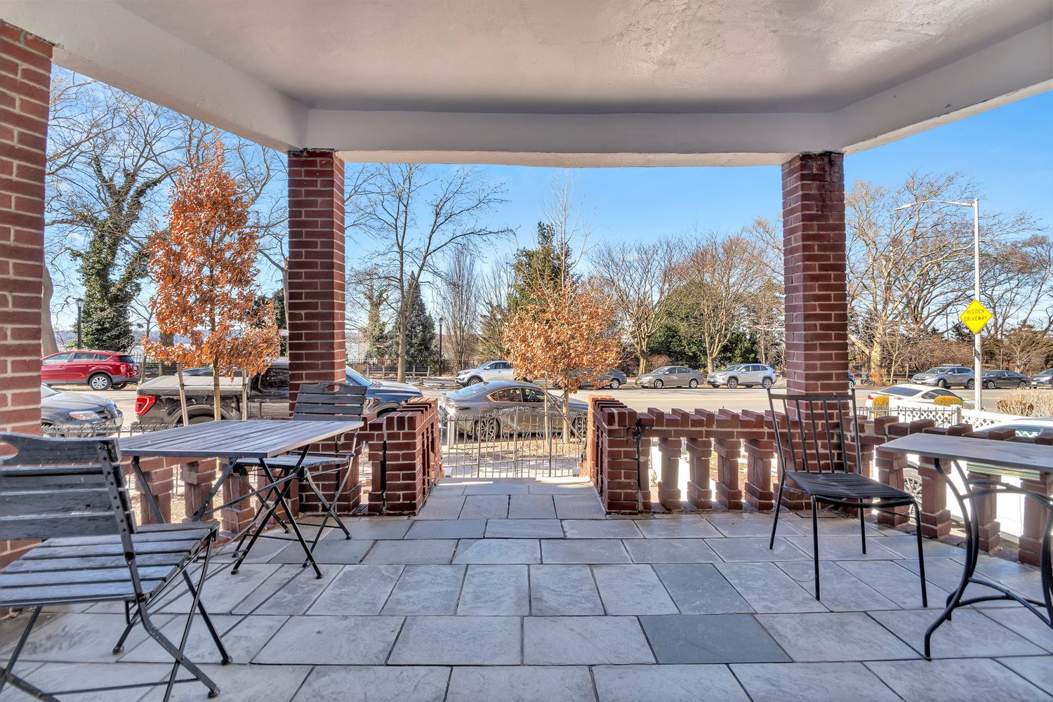 7001 Shore Road, Unit 2 Brooklyn, NY 11209 - Photo 14 of 17 a patio with glass top table and chairs