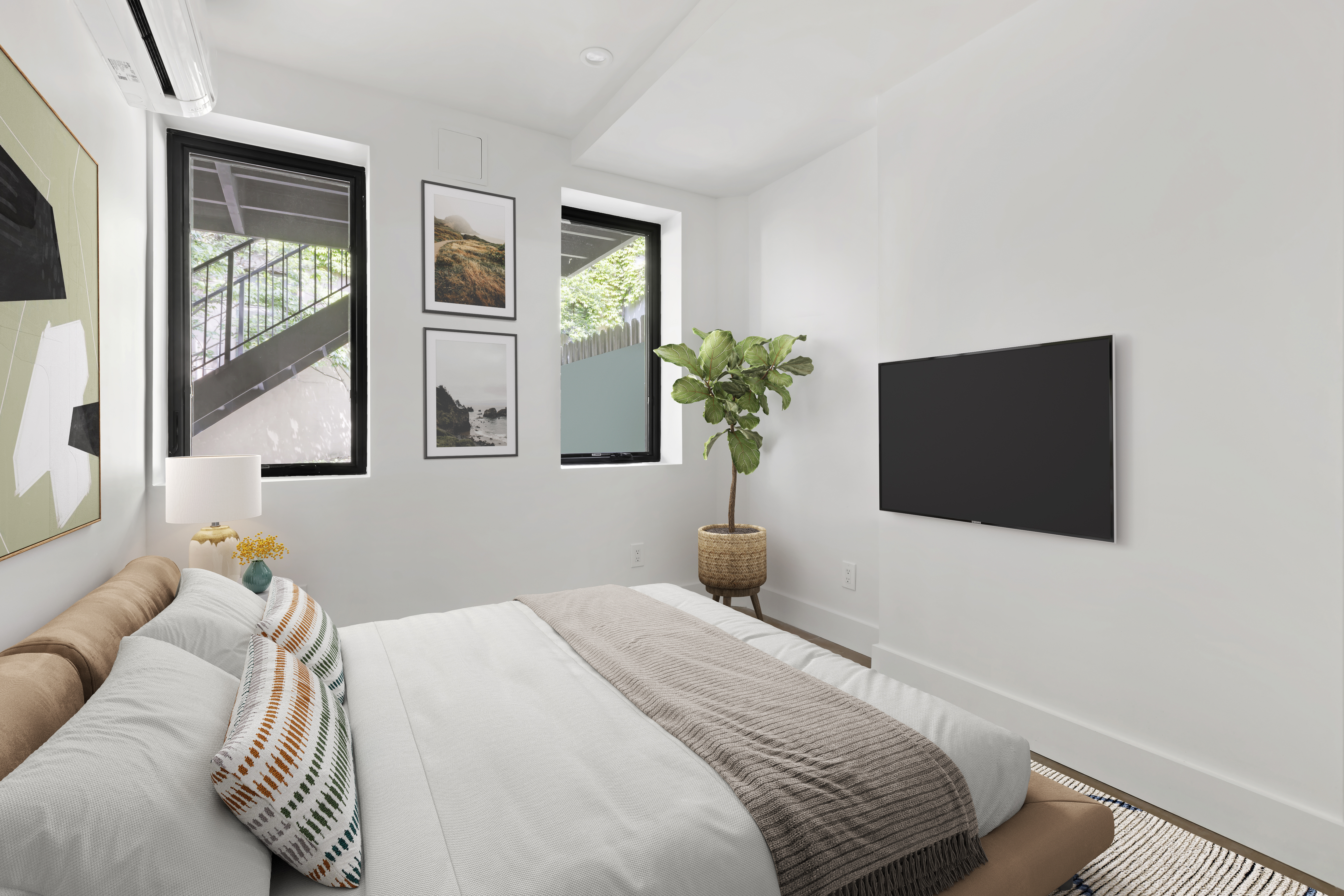 45-08 11th Street, Unit GARDEN Queens, NY 11101 - Photo 4 of 9 a bedroom with a bed and a flat screen tv