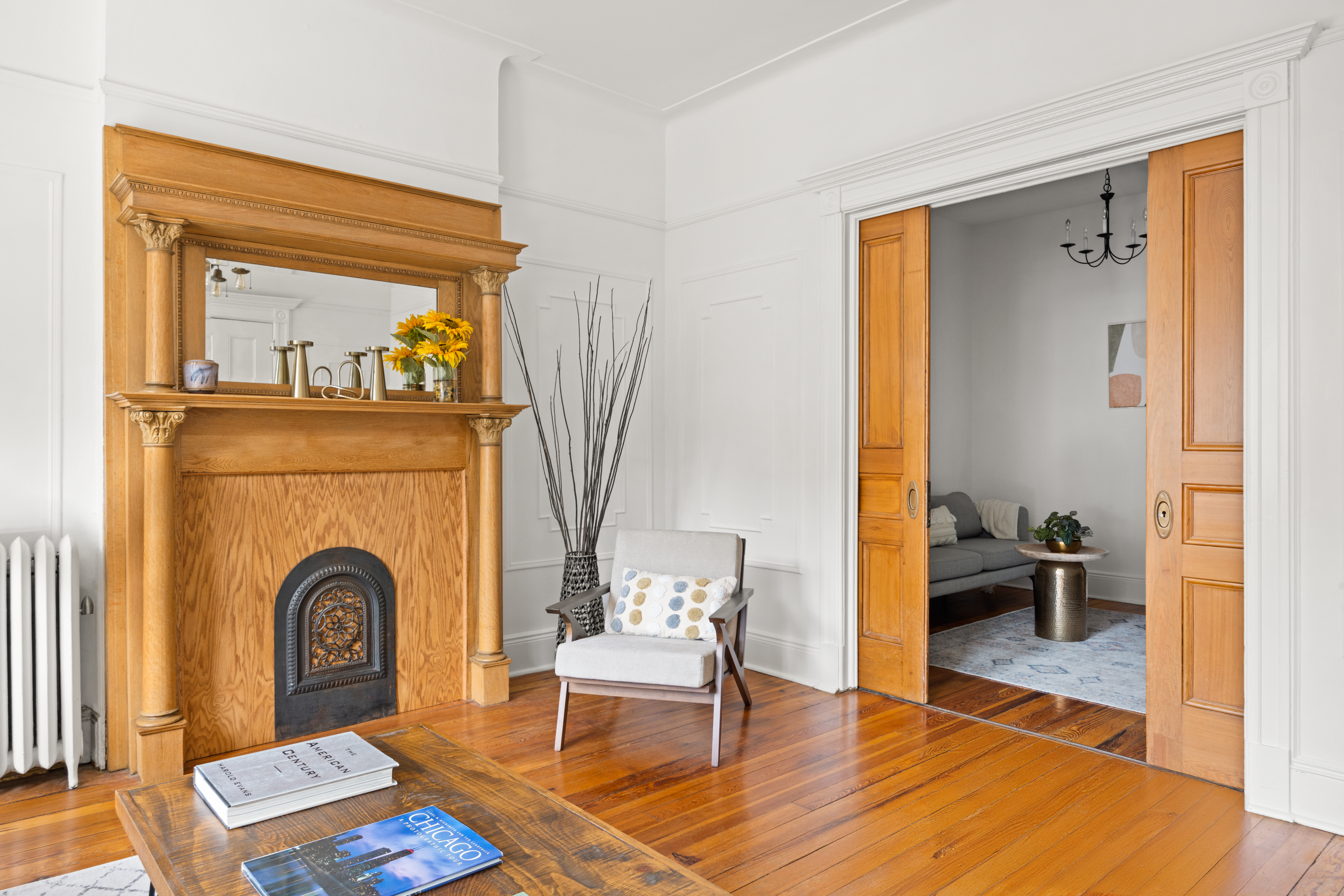 99 East 2nd Street Brooklyn, NY 11218 - Photo 2 of 24 a living room with furniture and a fireplace