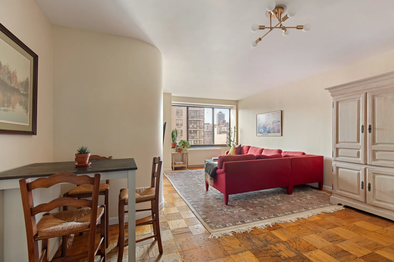 a living room with furniture gym equipment and a window