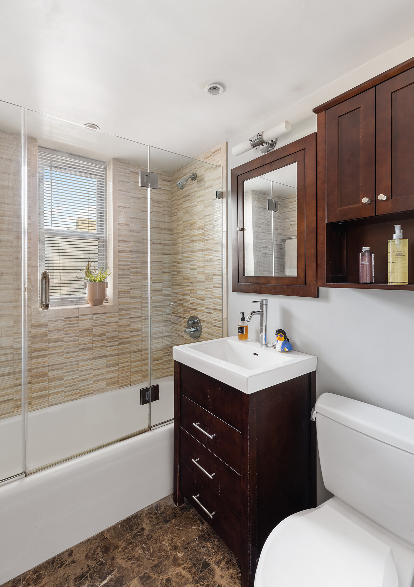 80 Park Avenue, Unit 19N Manhattan, NY 10016 - Photo 19 of 20 a bathroom with a toilet sink and bathtub