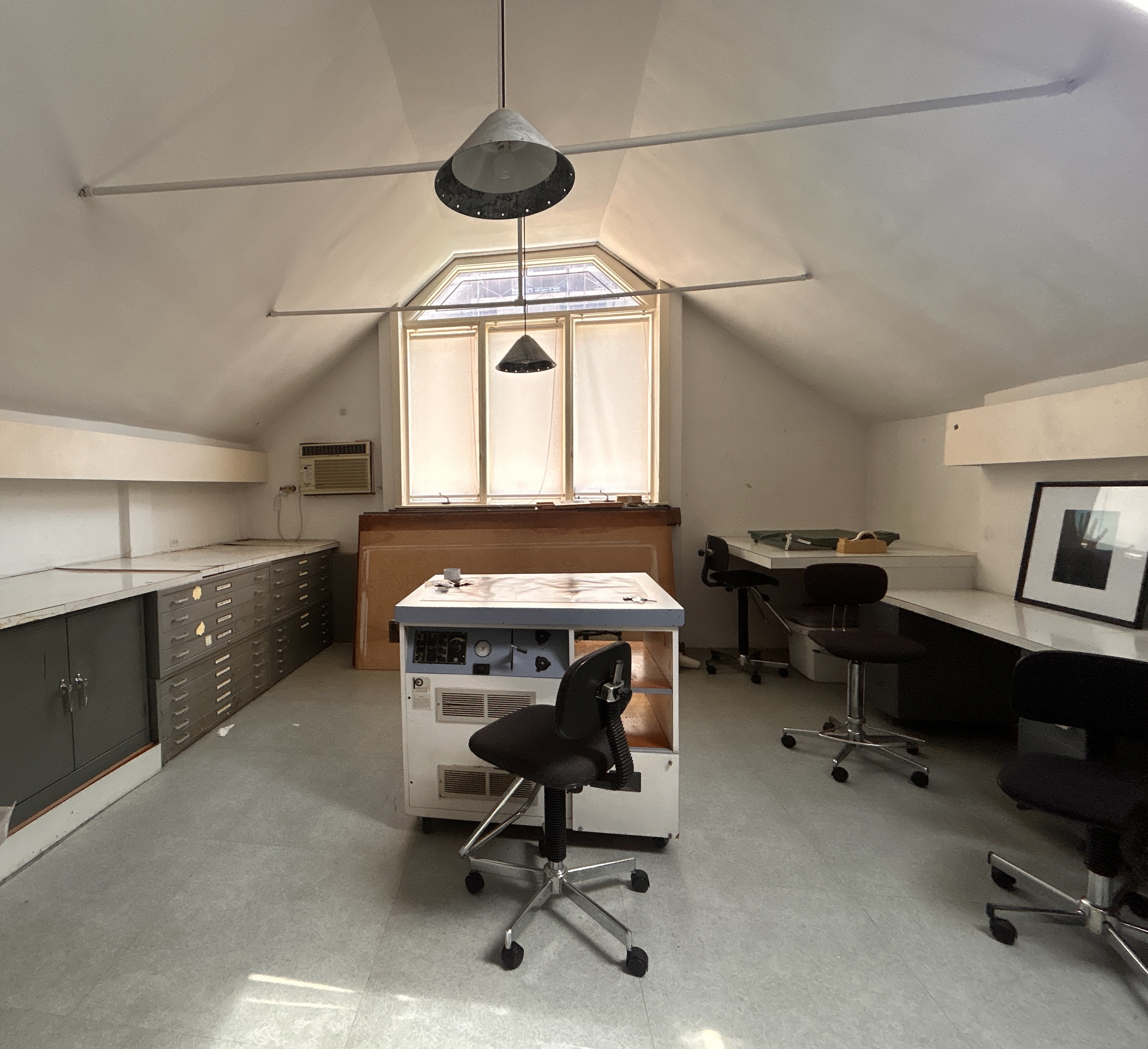 206 East 30th Street Manhattan, NY 10016 - Photo 16 of 17 a view of a workspace with furniture and a window