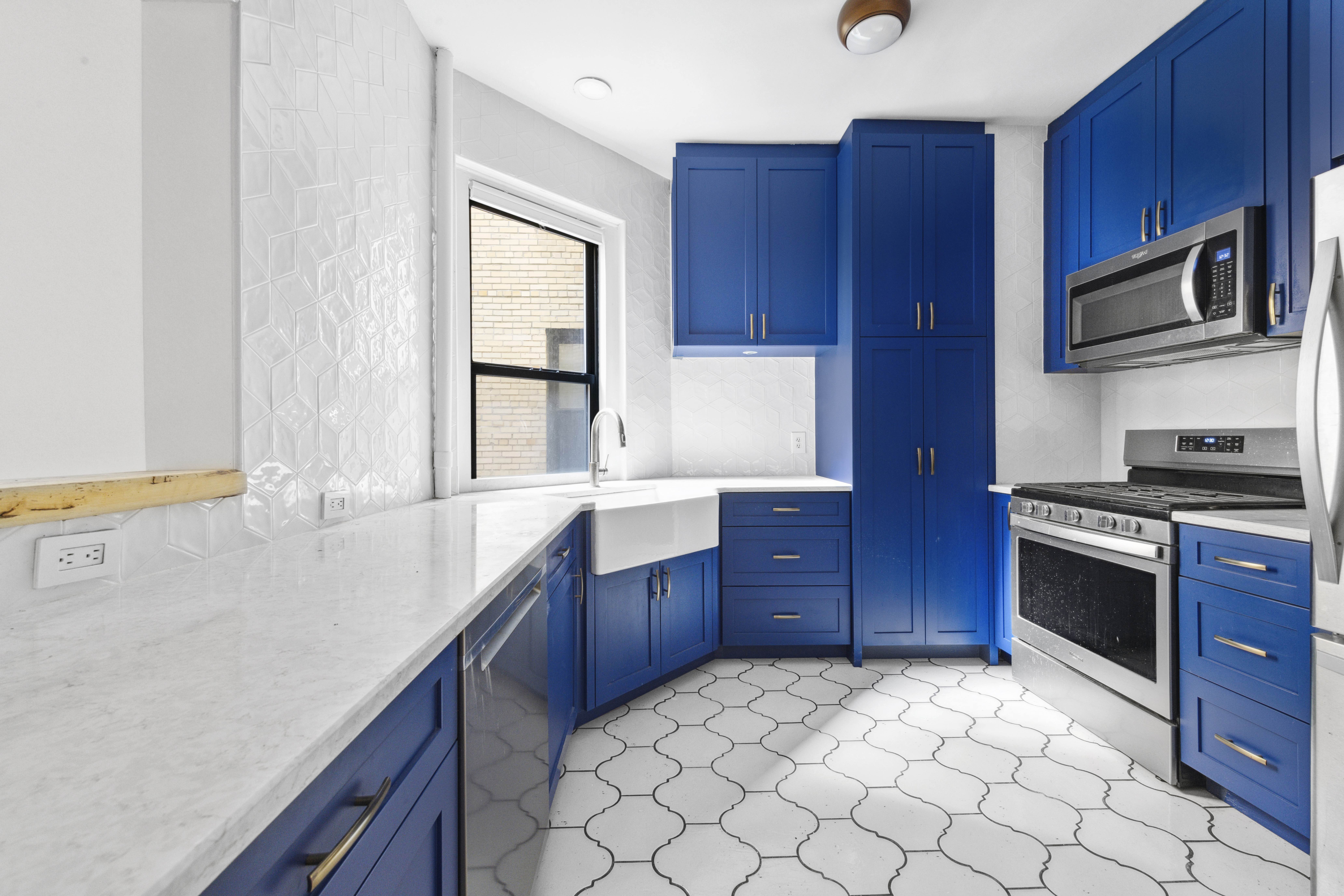 371 Fort Washington Avenue, Unit 2F Manhattan, NY 10033 - Photo 1 of 14 a kitchen with stainless steel appliances granite countertop a sink stove and microwave