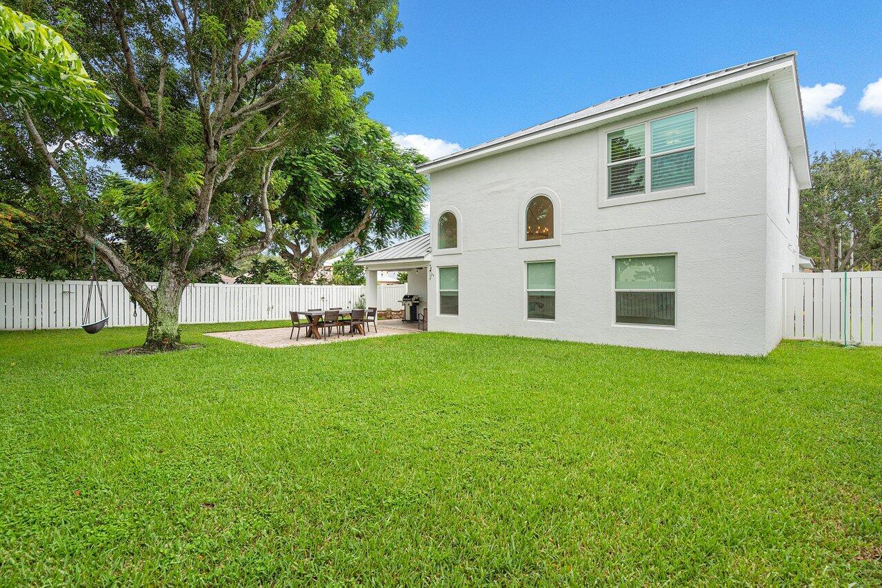 1182 Canoe Point Delray Beach, FL 33444 - Photo 30 of 46 a view of white house with backyard