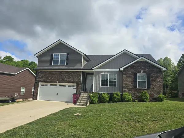 front view of a house with a yard