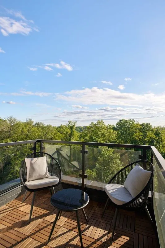 a view of a chairs and table in patio