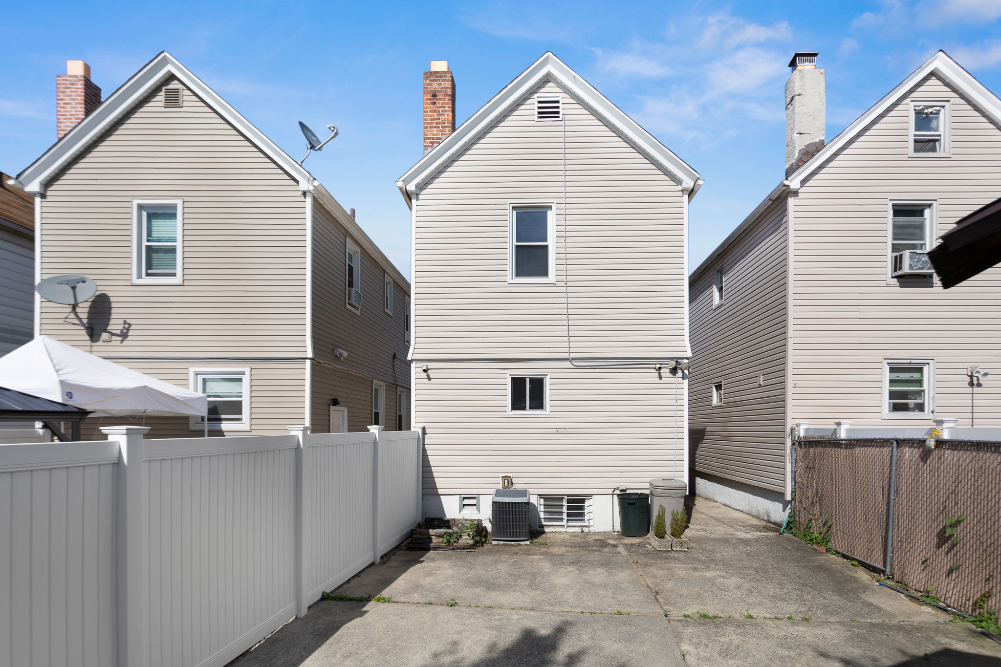 91-22 92nd Street Queens, NY 11421 - Photo 23 of 27 a view of a house with a yard