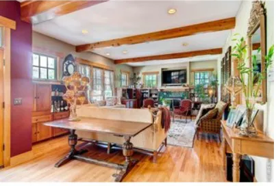 a view of a dining room with furniture window and wooden floor