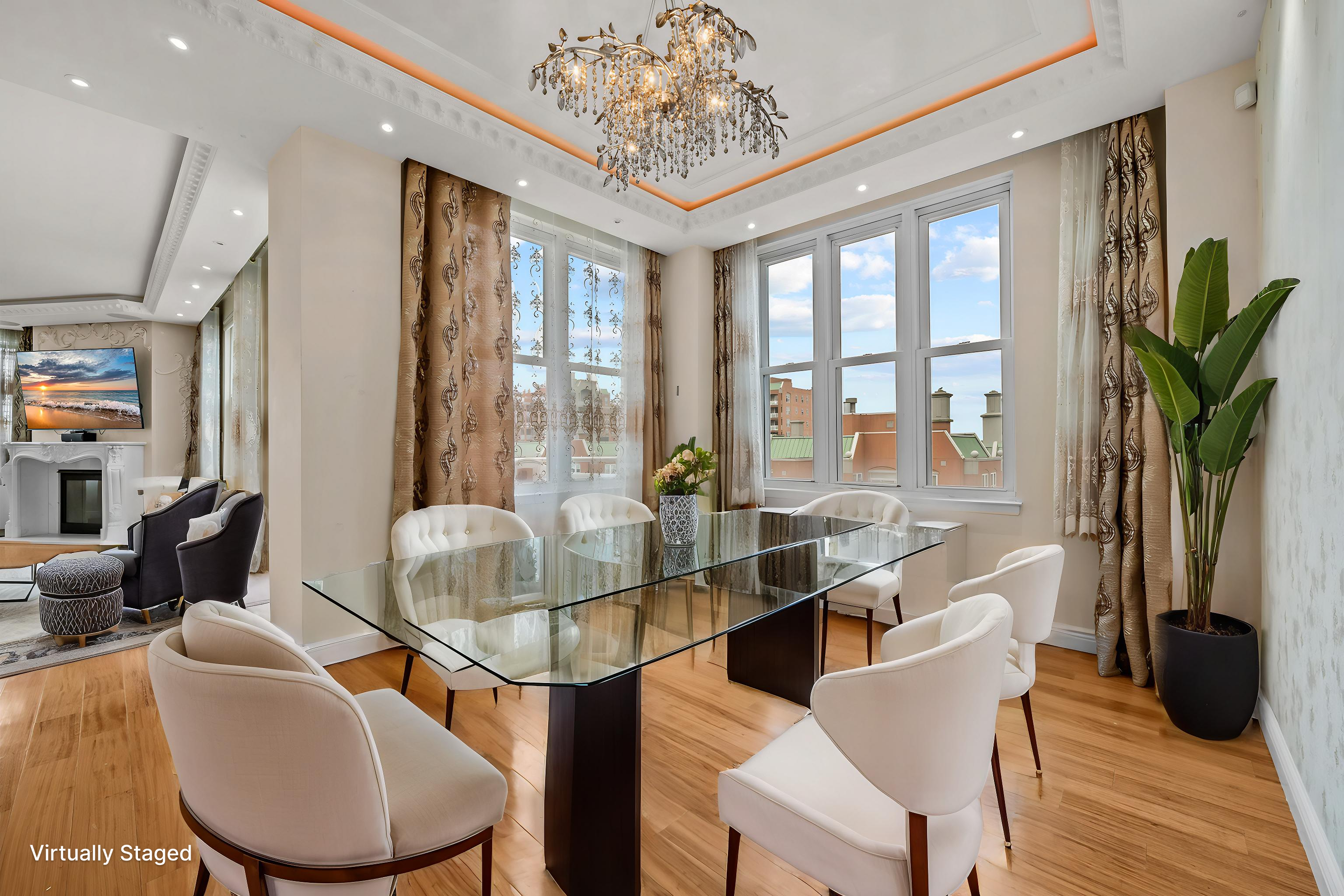 105 Oceana Drive East, Unit PH1D Brooklyn, NY 11235 - Photo 8 of 27 a dining room with furniture a chandelier and wooden floor