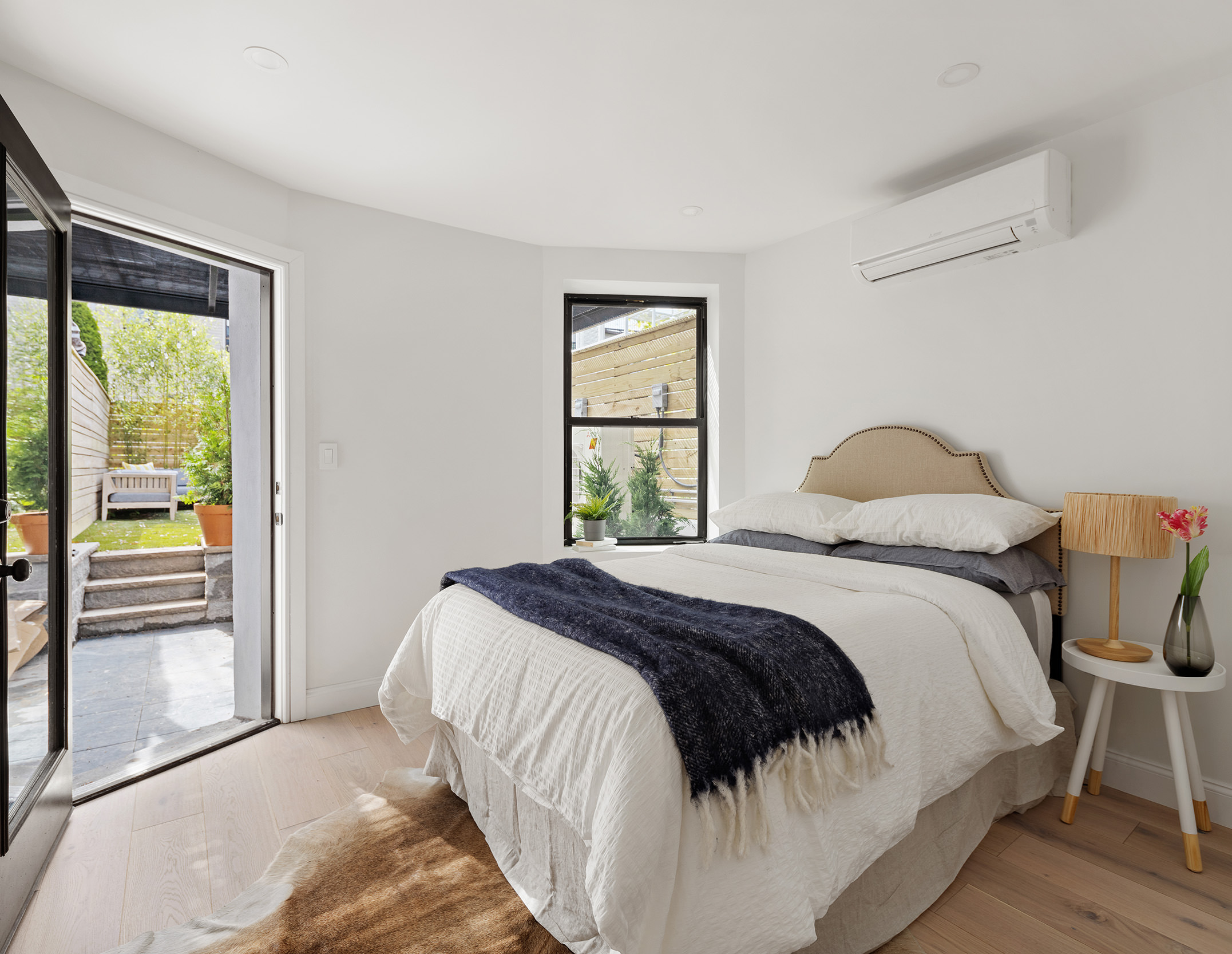 114 A Hart Street Brooklyn, NY 11206 - Photo 18 of 24 a bedroom with a bed and a window