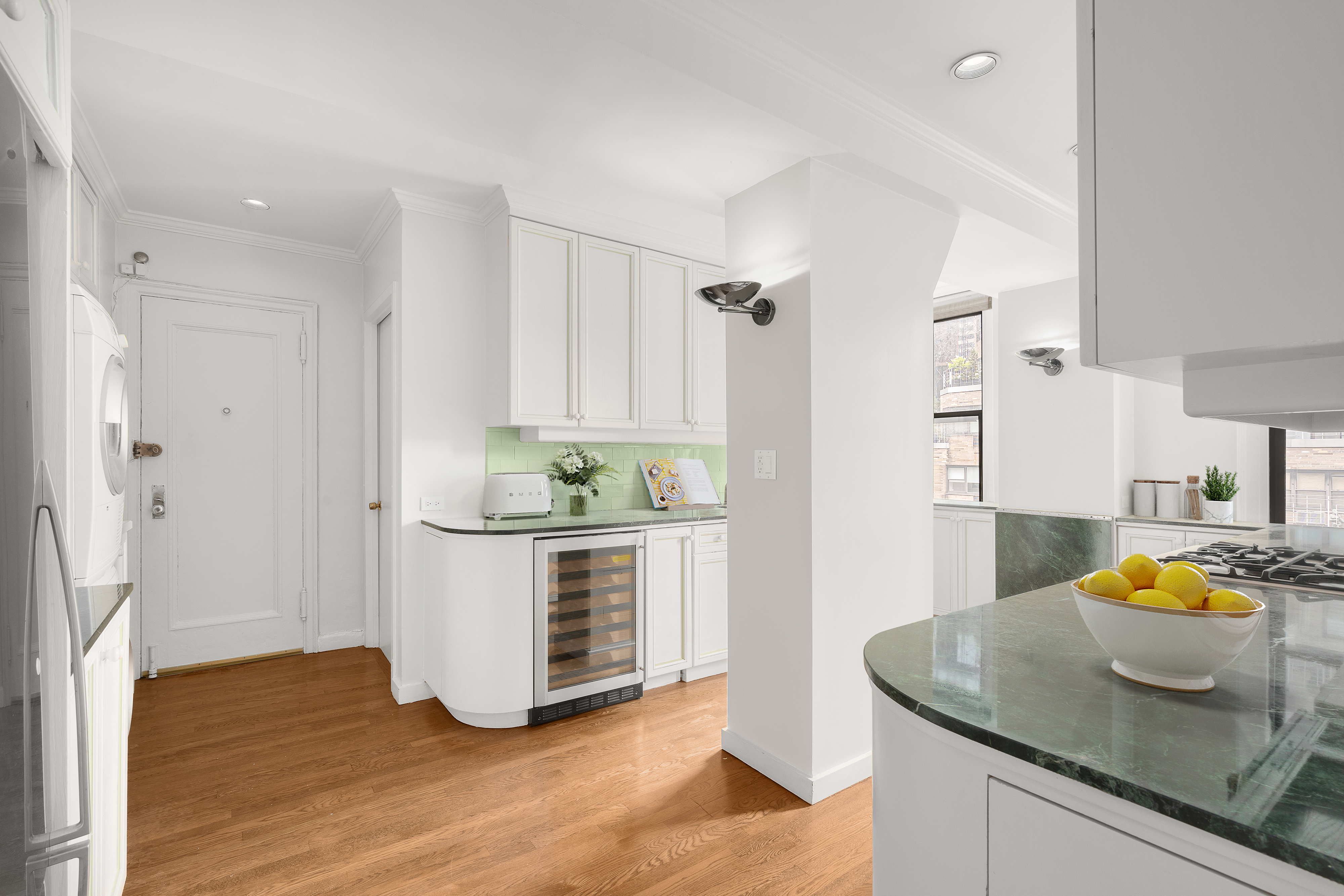 140 East 81st Street, Unit 12B Manhattan, NY 10028 - Photo 3 of 9 a kitchen with stainless steel appliances granite countertop a sink and a granite counter tops