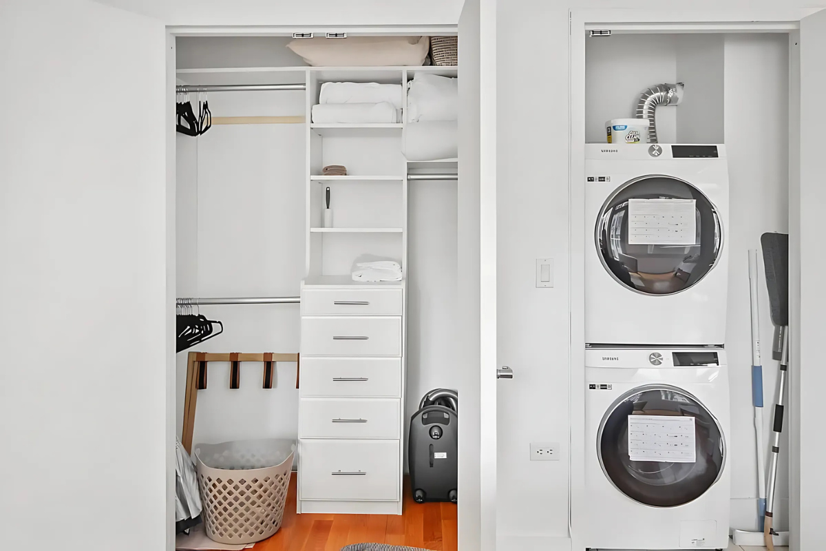 154 Attorney Street, Unit 304 Manhattan, NY 10002 - Photo 8 of 13 a view of a bedroom with washer and dryer
