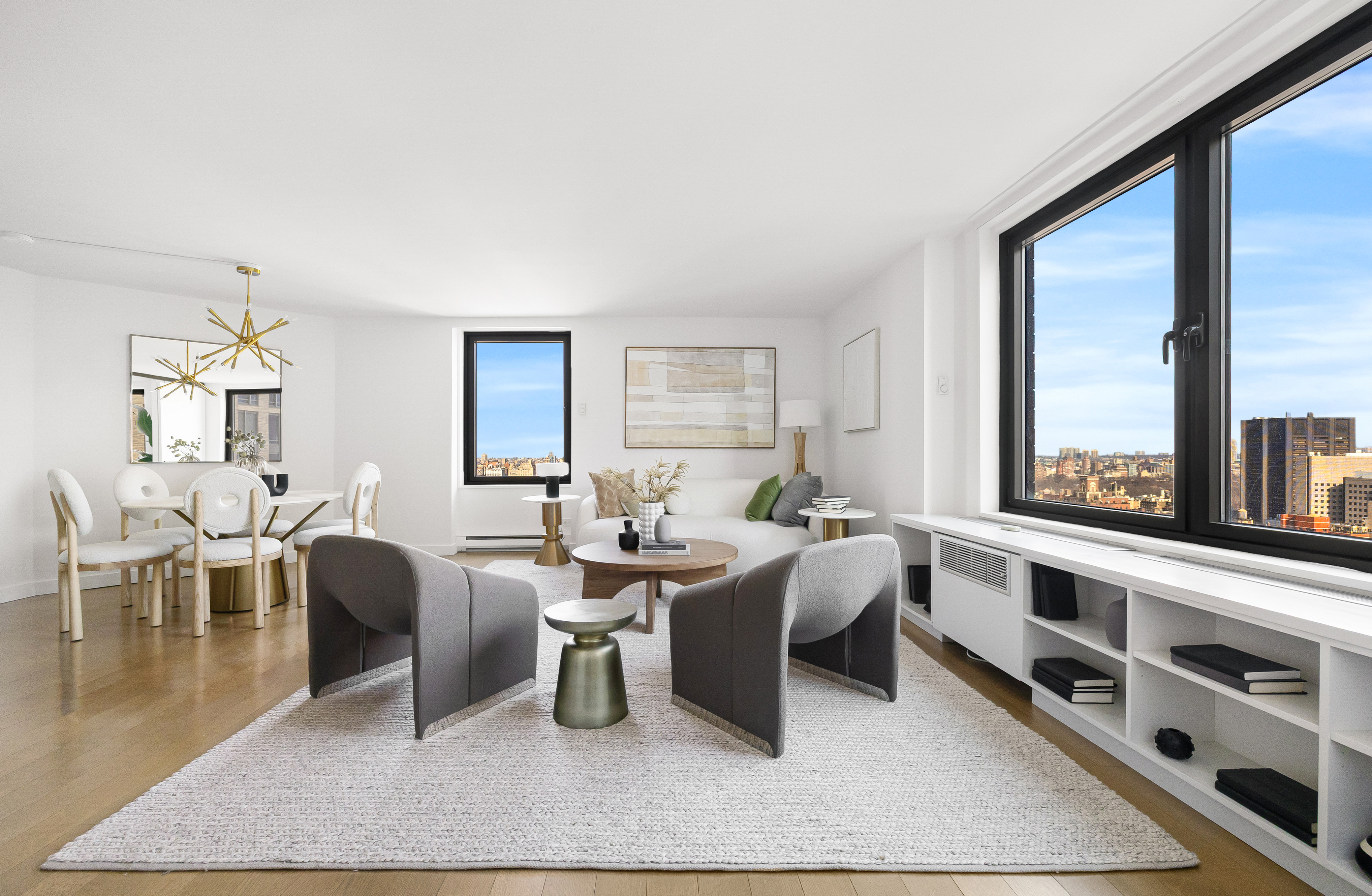 a living room with furniture a rug and a large window