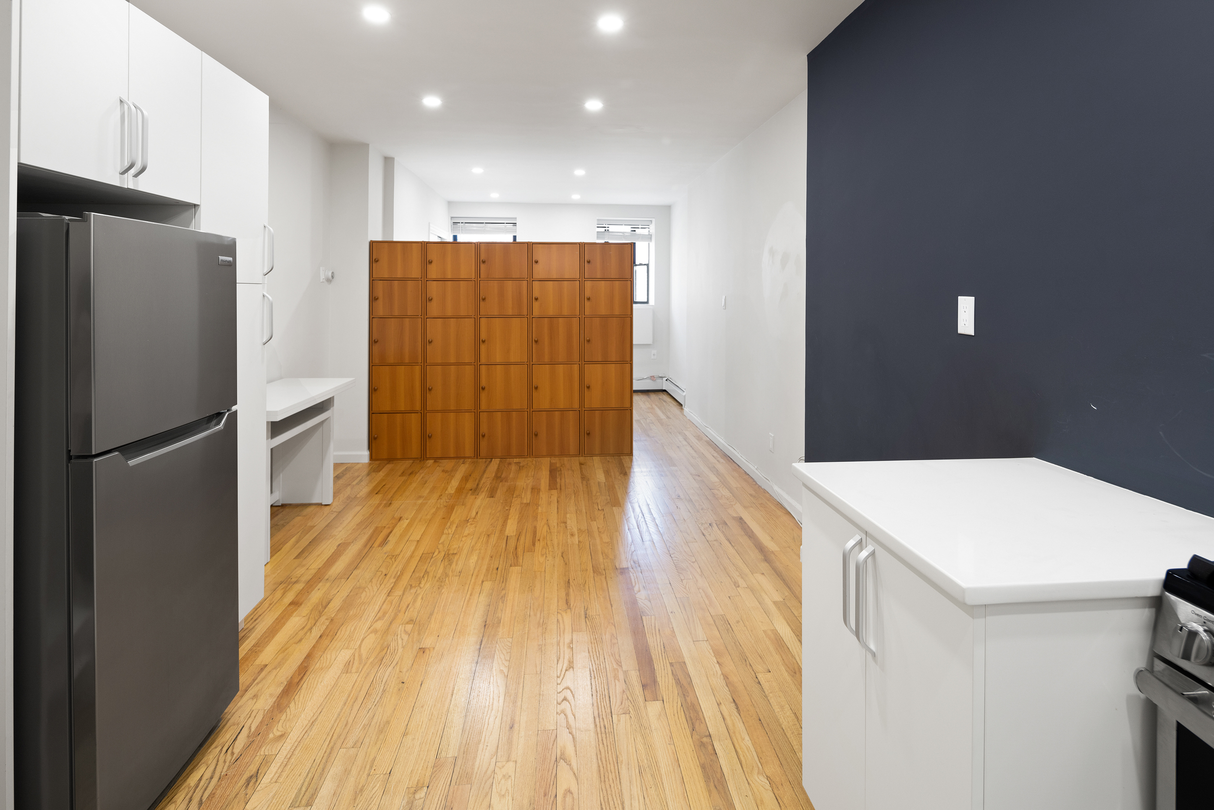 101 Allen Street, Unit 3A Manhattan, NY 10002 - Photo 2 of 5 a kitchen with a refrigerator and a sink